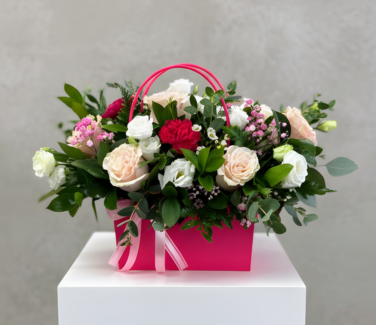 Blooming Purse - A chic floral arrangement featuring a mix of roses and seasonal flowers designed inside a stylish purse-shaped vase. Playful yet elegant, this unique design is perfect for birthdays, celebrations, and fashion-forward gifting.