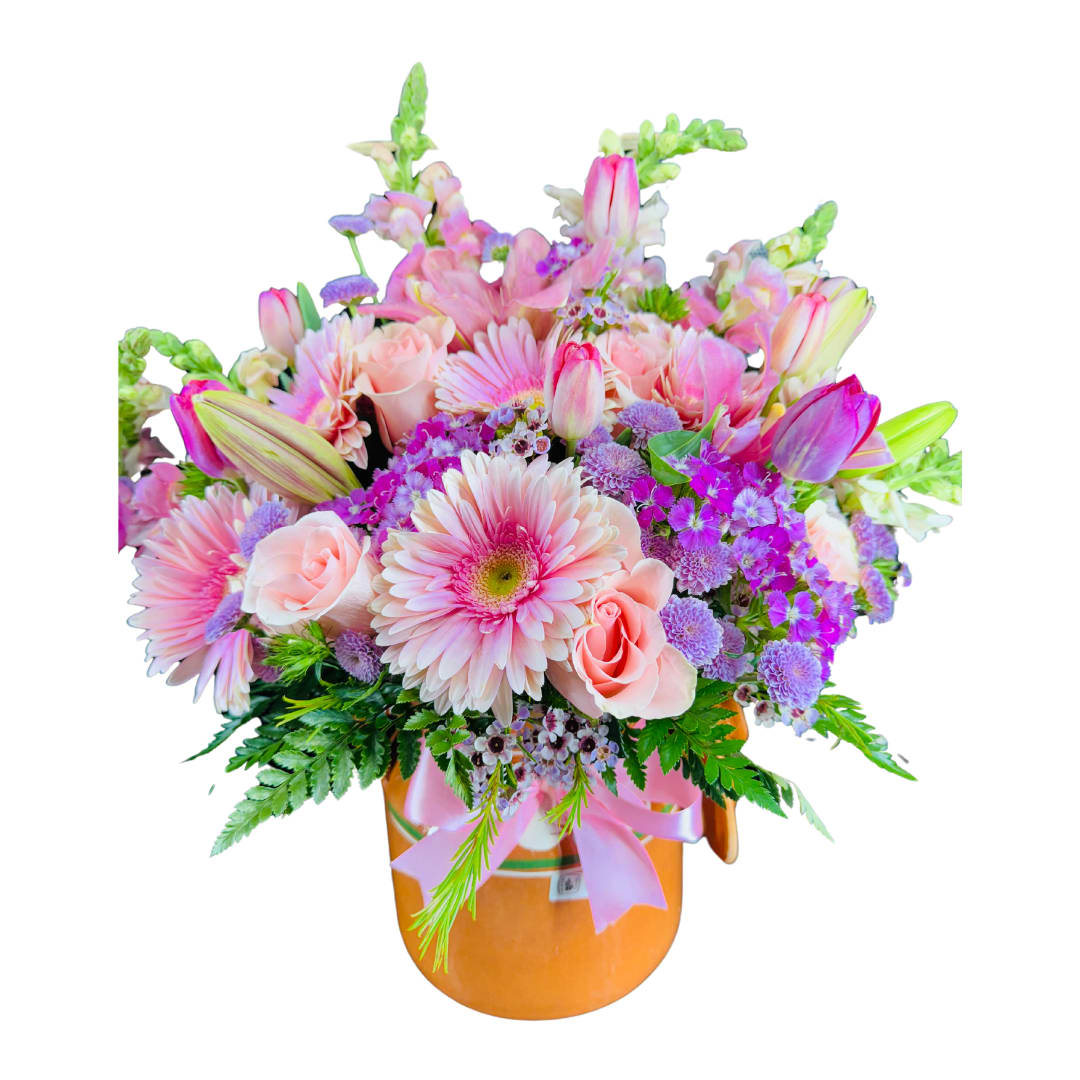 Colorful Bloom - Unique Vase  Mixed flowers  Greenery Due to seasonal availability, certain flowers may vary. In the event that a specific variety is unavailable, we may substitute it with a similar flower of equal or greater value.