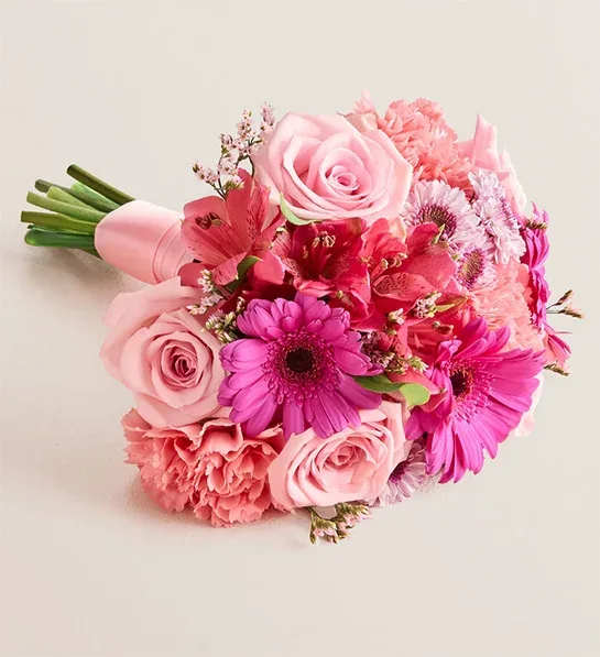 Prom Bouquet - Pink - NEW Inspired by the latest prom trends, our hand-designed bouquet is nothing short of dazzling. Fresh, richly colored roses, Peruvian lilies, and other blooms make this ideal for any belle of the ball.