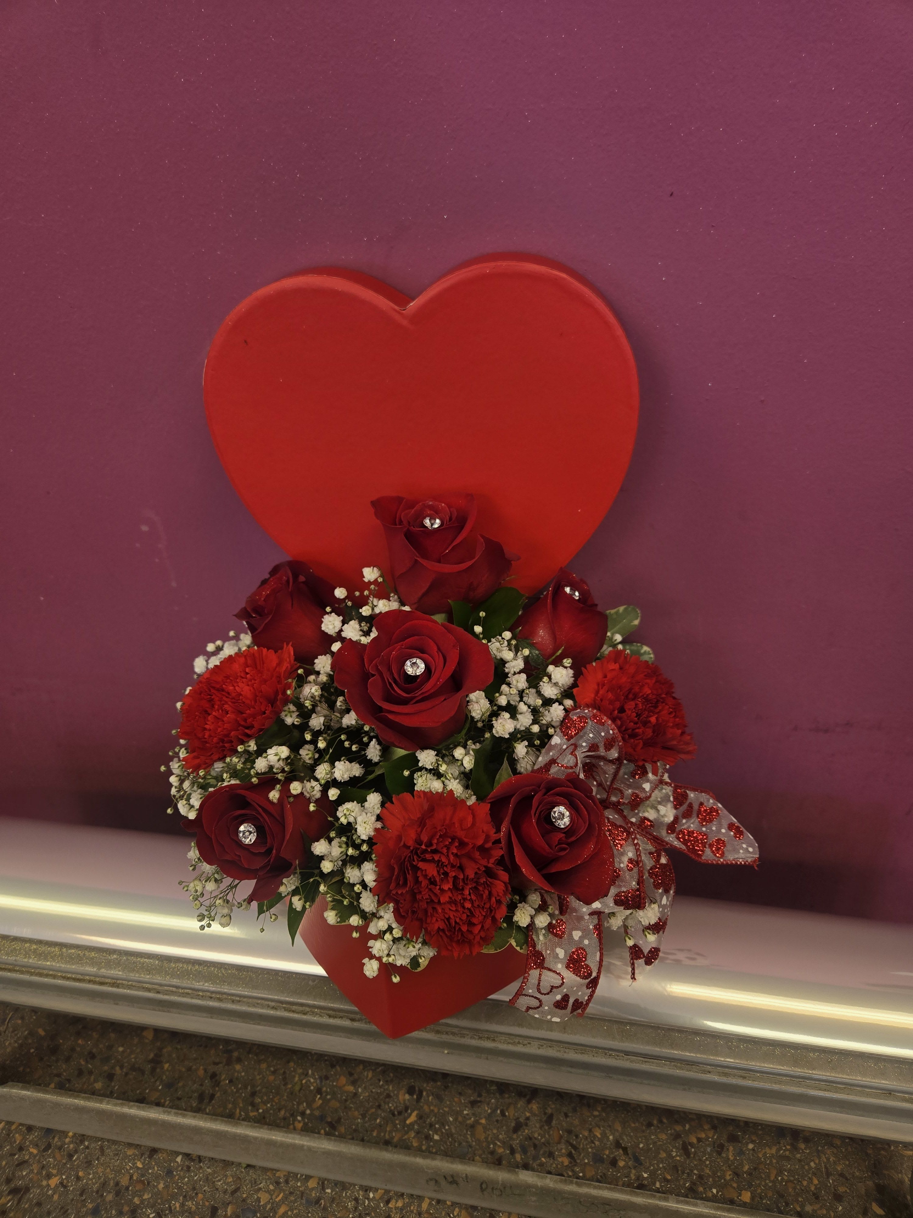 Love Shines Bright - adorable heart box with 6 gemmed roses and red carnations surround in a cloud of babies breath a sure-fire way to say I love you 