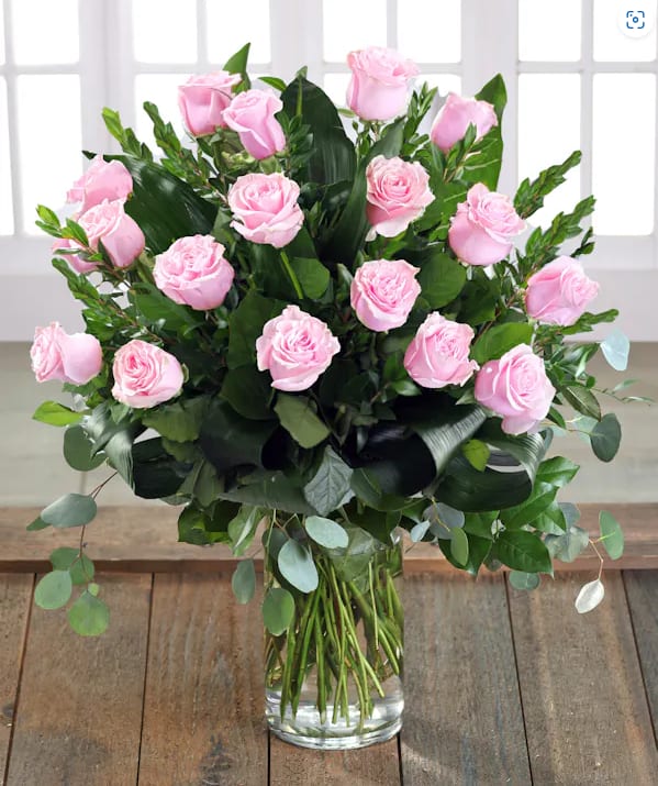 Make Me Blush - Make Me Blush - Dozen Long Stemmed Pink Roses Details Blushing pink roses and delicate white limonium add up to a feminine arrangement that's at once sweet and innocent – and fabulously flirty!  One dozen pink roses are gathered with white limonium and rich green salal in a classic trumpet vase she'll use again and again.