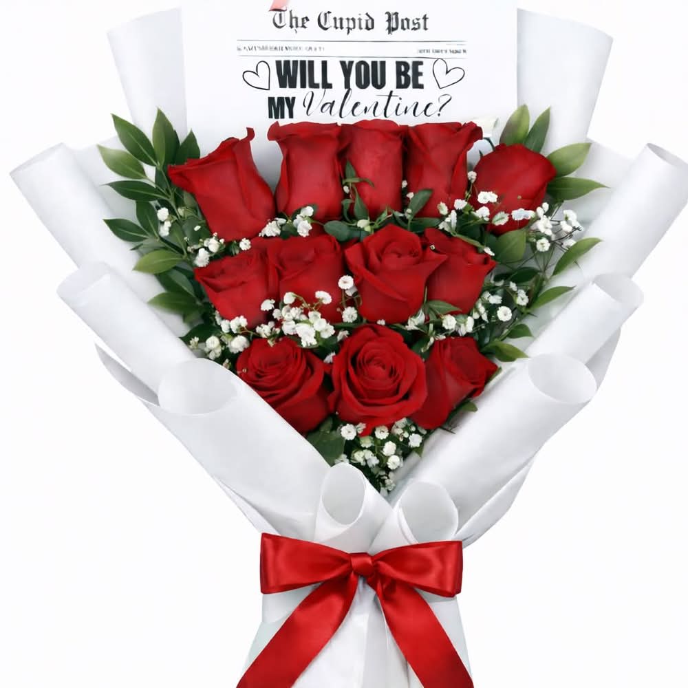Will You Be My Valentine? Bouquet - A timeless expression of love, this elegant handtied bouquet features beautiful rich red roses, delicately accented with fresh baby’s breath. Wrapped in layers of white designer paper and finished with a classic red satin bow, this bouquet is crowned with a heartfelt 'Will you be my Valentine?' message, making it perfect for Valentine’s Day.