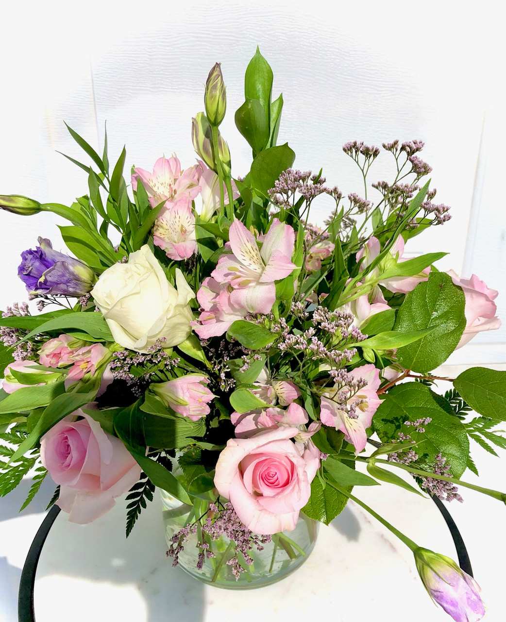 Sweetest Day - Mixture of pink and white Roses with purple accents