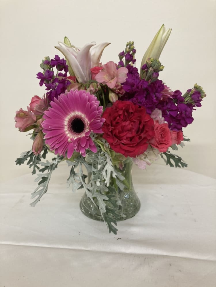 Romance in Bloom - Gerber daisies, stargazer lilies. alstromeria, roses, and stock