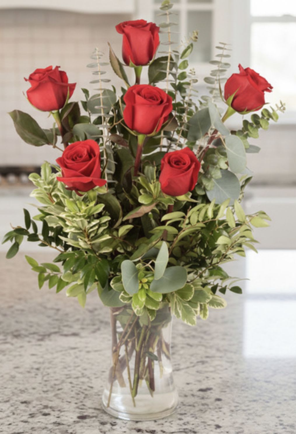 6 red rose vase  - Six premium red roses with greenery and filler in a glass vase