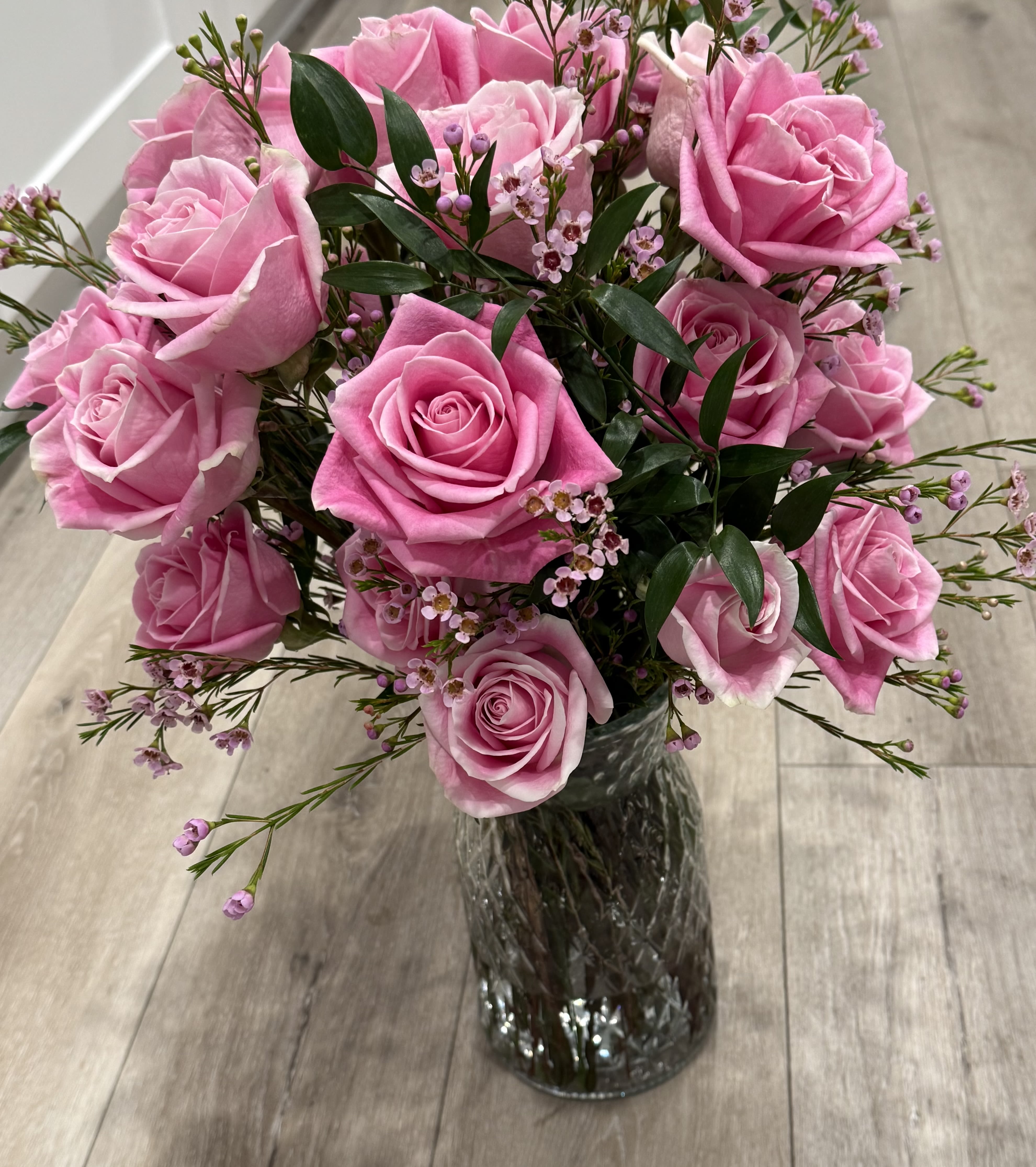  Vibrant Love  - 24 Bright pink rose arrangement with wax flower and greenery   
