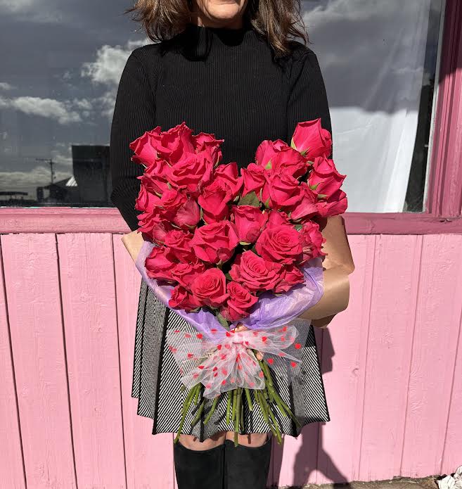 Heart-shaped Wrap - 30 large hot pink or red roses are arranged in a heart-shaped bundle.  Call shop to ensure we have hot pink or red because our inventory constantly changes.