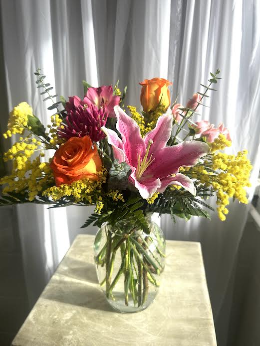 You're My Sunshine - Lilies, roses, acacia and more are gathered in a cheerful, fragrant mix.  Call shop to find out exactly what we'll be using because our inventory changes daily and we substitute when needed.