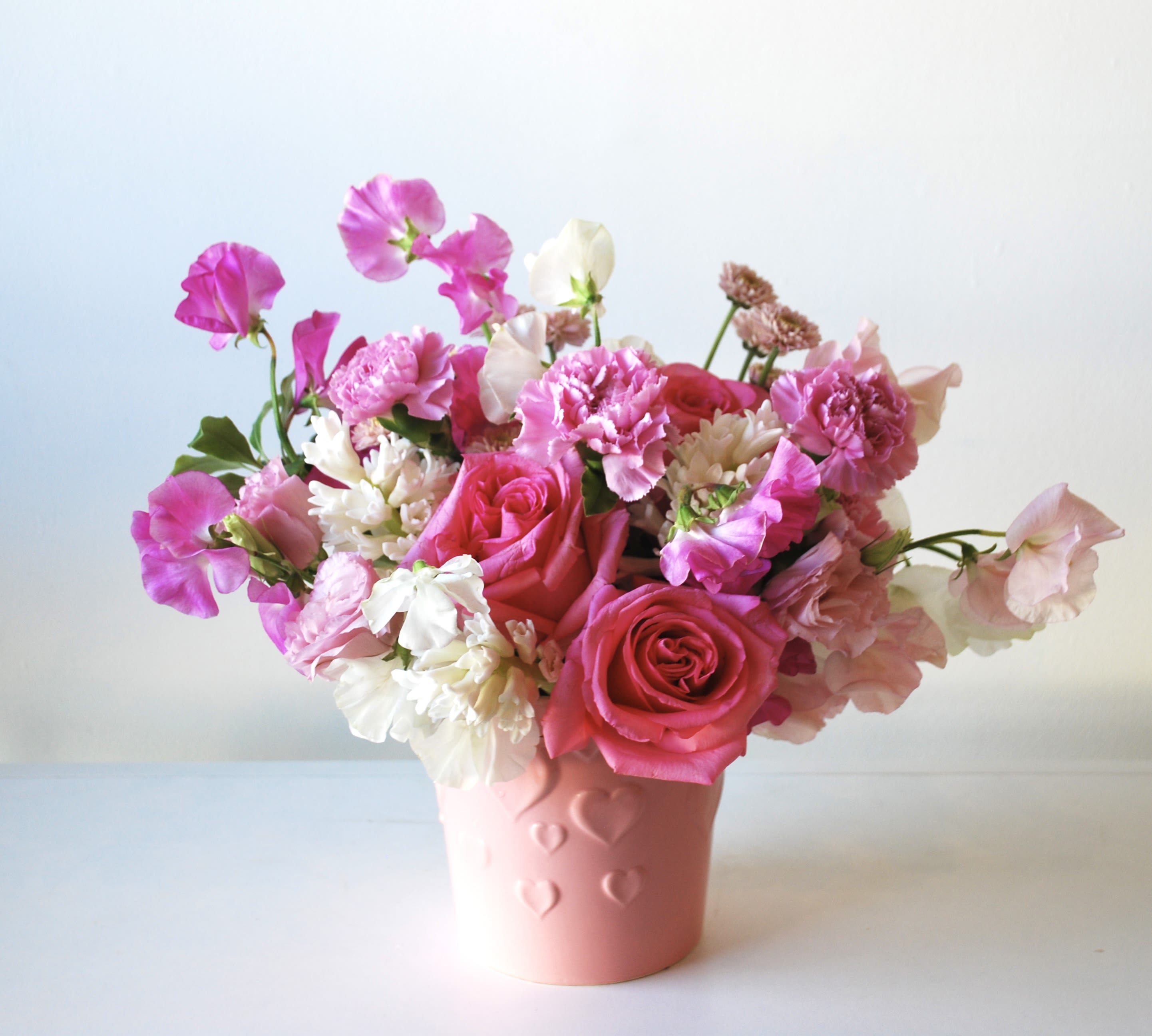 Bunny tail - Can’t you imagine going home with this?   This pink and white arrangement will make your special someone very happy