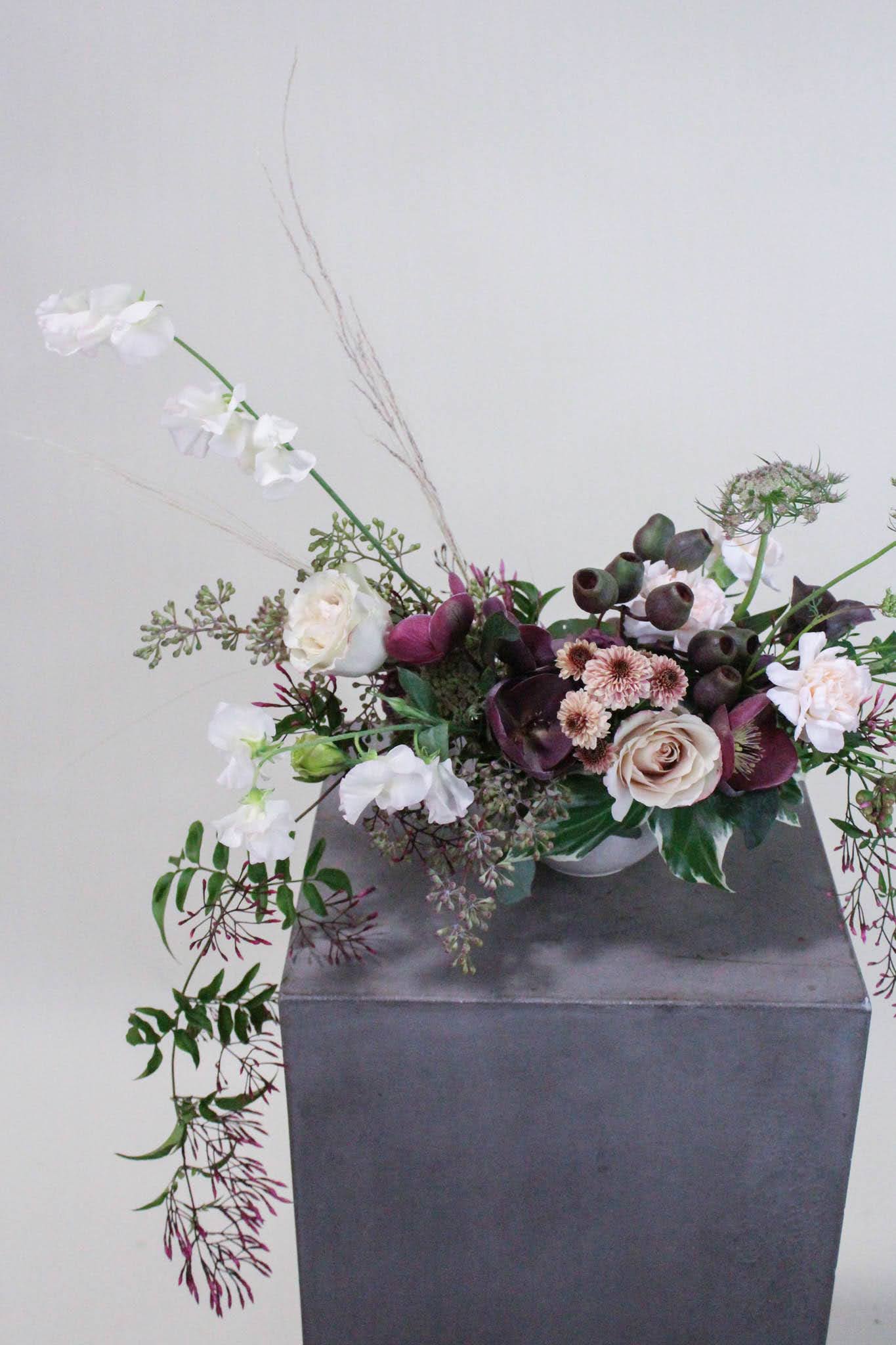 Moody Centerpiece  - Lush, low and sprawling centerpiece great for elevating any table. Order multiples for King and Queen's tables or to fill many round tables at your event.  *Images are a representation of our design style. Each arrangement is made to order and flower selection will vary due to product availability the week of your order. to elevate any table or event.