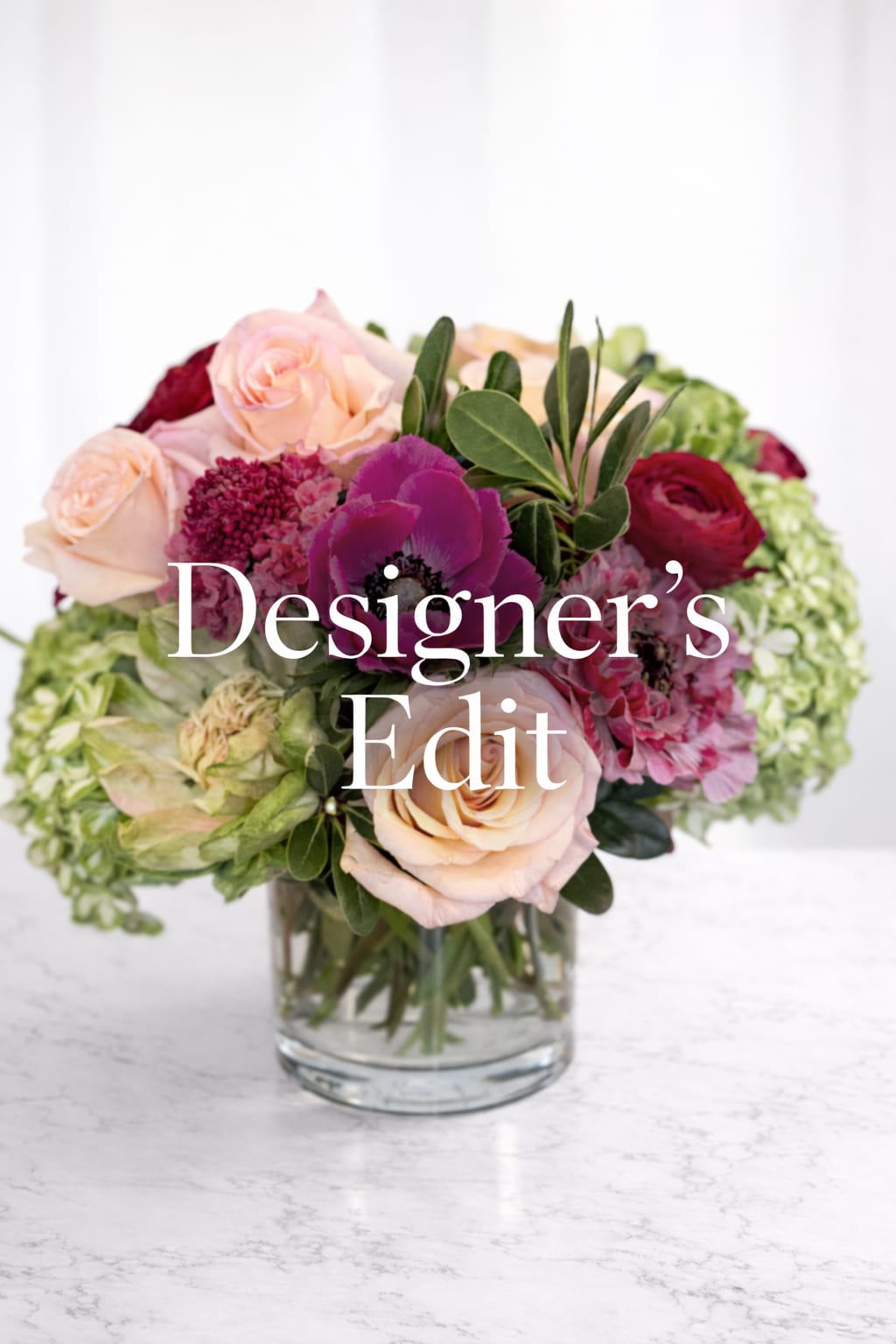 Designer's Edit - Our Designer’s Edit is an invitation to trust the artistry.  This arrangement is thoughtfully created using the most stunning blooms available that day — chosen for their beauty, rarity, and seasonal relevance. Guided by color, movement, and mood, each piece is entirely one-of-a-kind and designed with the same intention and care that defines all of our work.  No two Designer’s Edit arrangements are ever the same. What remains consistent is the experience: elevated florals, unexpected details, and a composition that feels personal, expressive, and unforgettable.  Perfect for those who appreciate artistry, love being surprised, and want the very best of what’s in bloom right now.  Please note: Flower varieties and color palettes will vary. Size, style, and overall aesthetic will reflect the signature look of Breathtaking Blooms CLT. Upgraded arrangements may be larger and/or include different flowers.