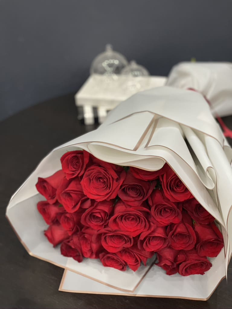 2 Dozen red roses  - 2 Dozen red roses hand-crafted bouquet. VASE NOT INCLUDED!