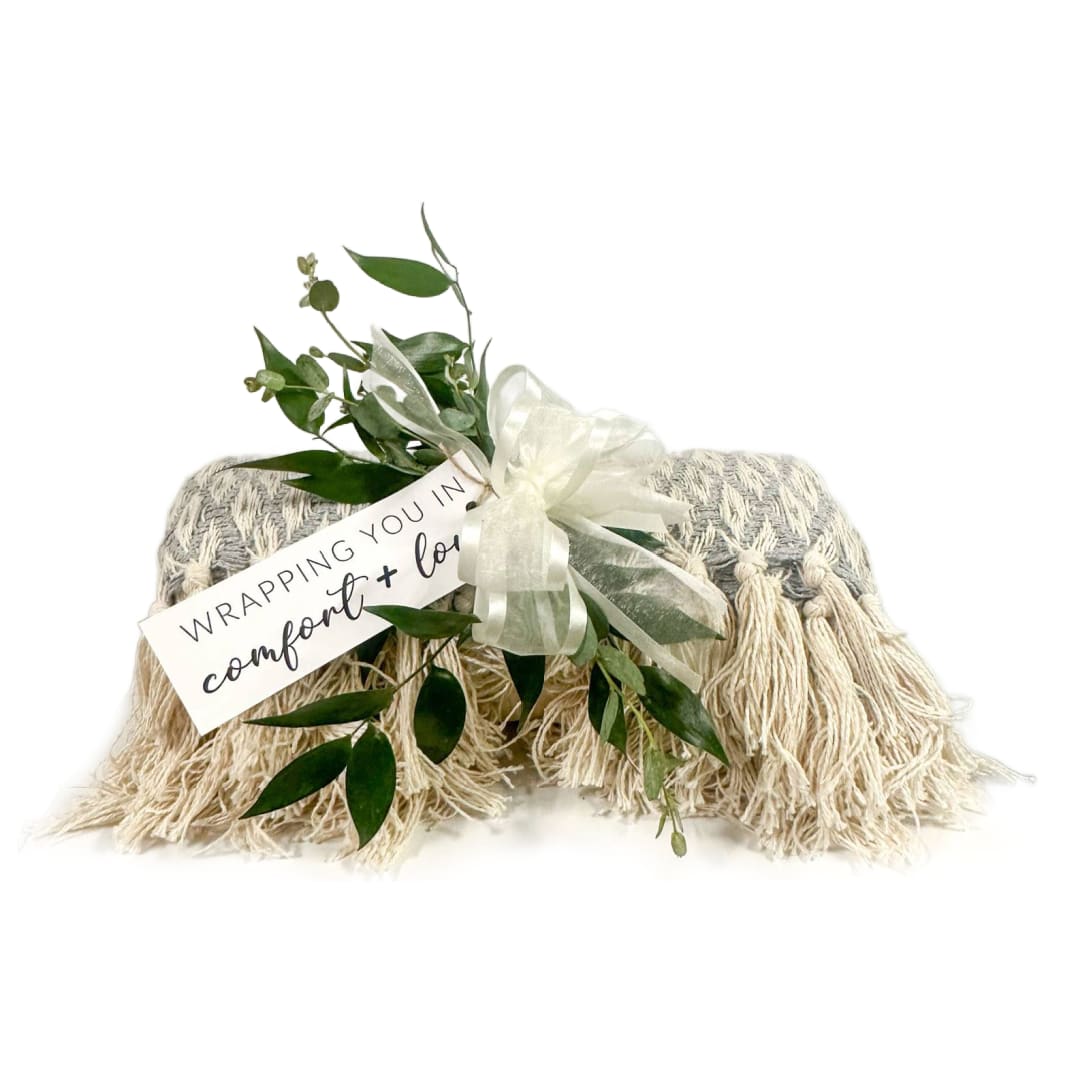 Wrapped in Love Blanket  - This is a 50 X 60 inch woven throw blanket adorned with fresh greenery and a bow.   colors and designs may vary but will be grey/beige
