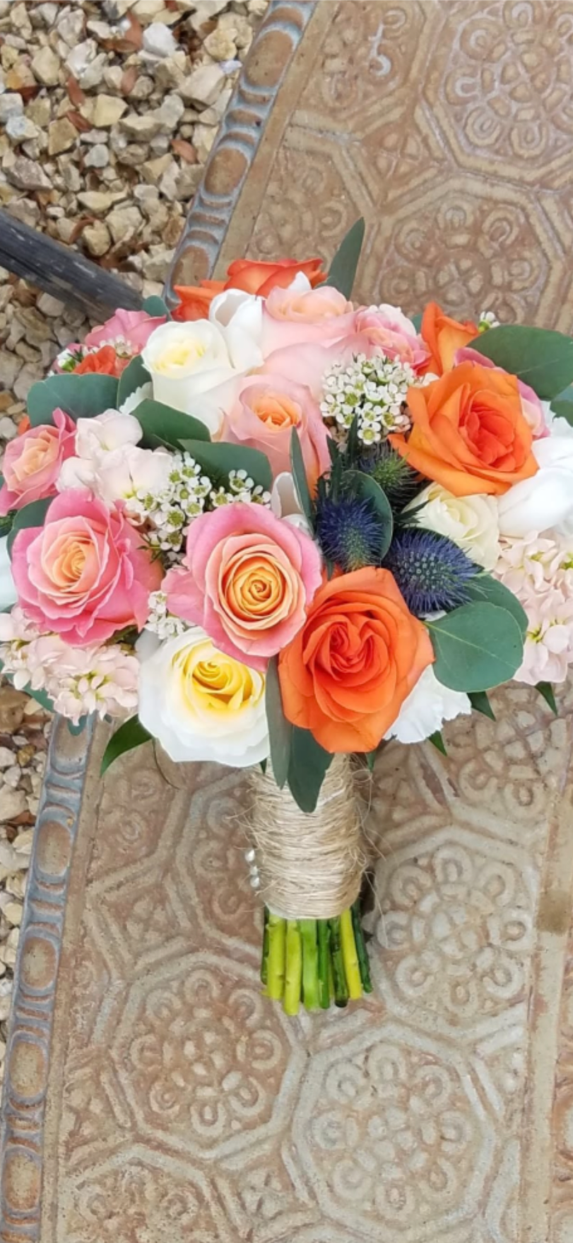 Peaches &amp; cream and a tangerine more. - A floral symphony with a harmony of summery flower notes.  This vibrant bridal bouquet is the perfect choice for celebrating love in any season of the year.  All bridal bouquets include groom's boutinier.
