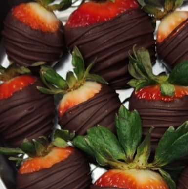 Chocolate Covered Strawberries 8 Pk - Treat that special person in your life! 8 hand dipped chocolate covered strawberries made from a local artisan. 