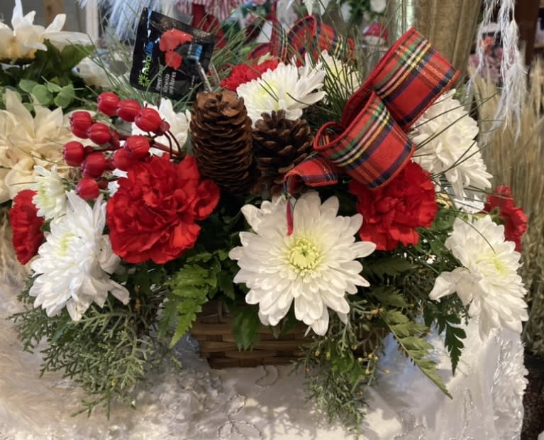 The Night  Before Christmas - Red carnations, white mum daisies, with red berries and Christmas greenery.