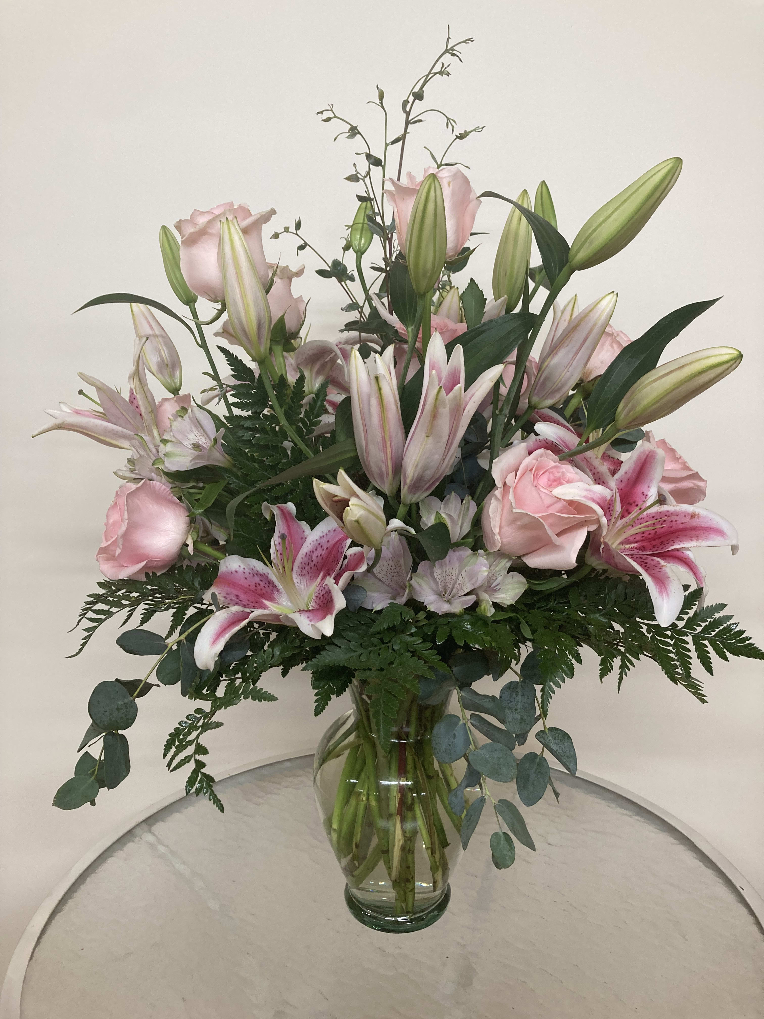 Pink, Pink, and Pink - Stargazers and pink roses share space among the eucalyptus and leatherleaf.