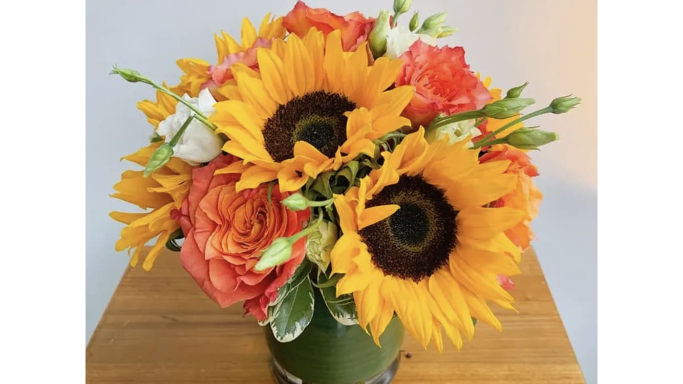 A Warm Day - Relax in the warmth of sunflowers and orange garden roses.