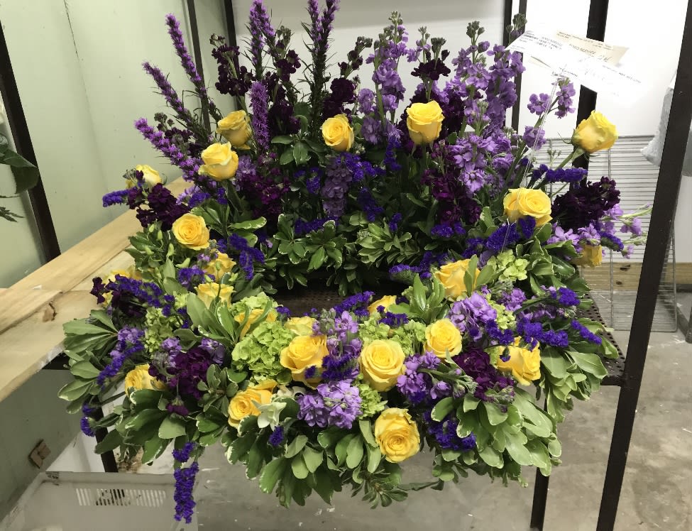 Urn Piece in Purple and Golden Yellow - Golden yellow roses with purple statis, purple and lavender stock, and purple Blazing Star liatris