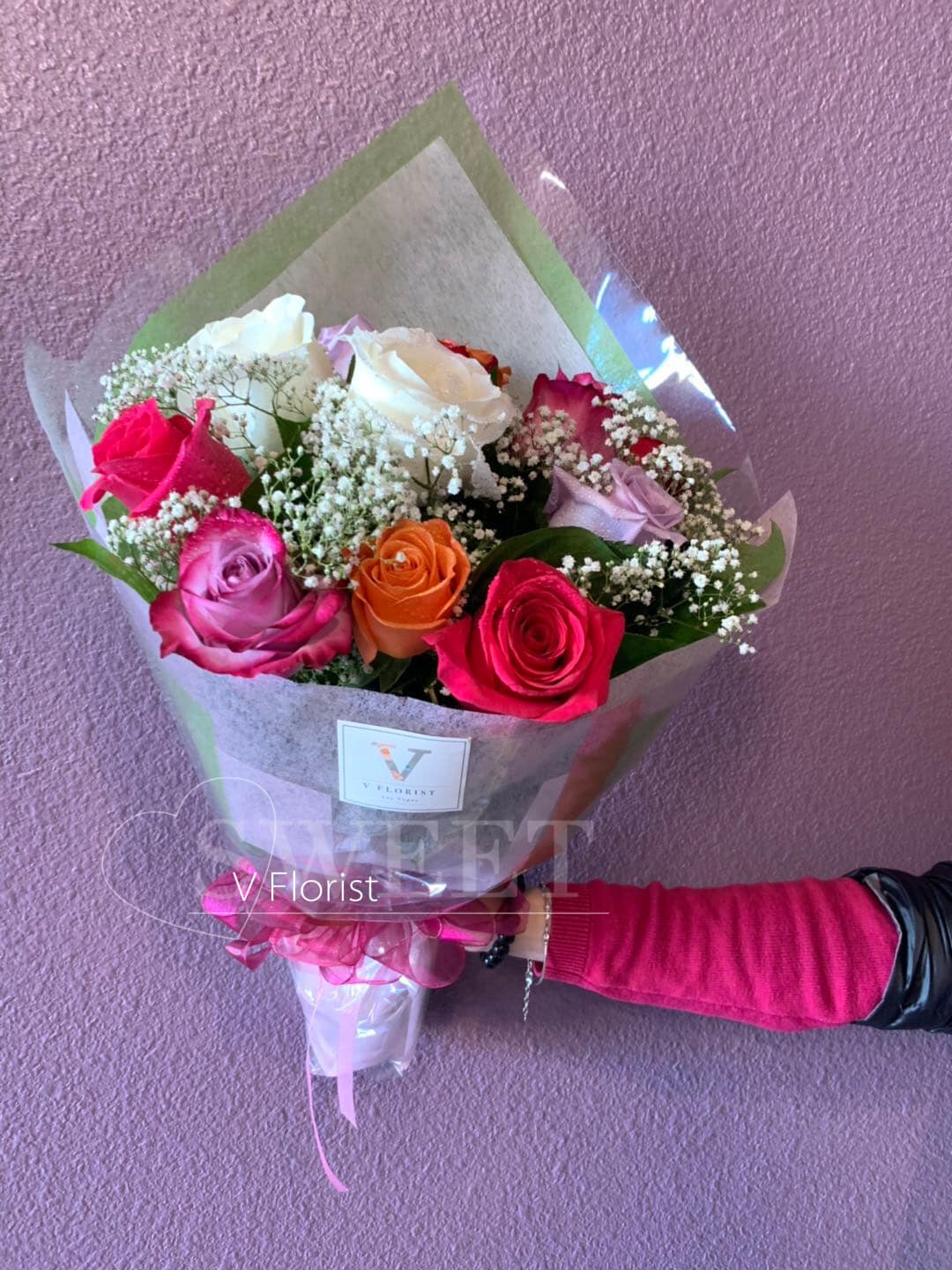 Assorted roses Bouquet - Simple style wrap bouquet with 12 assorted color roses and fillers.  Our florists select the freshest flowers available, so colors and varieties may vary due to local availability.