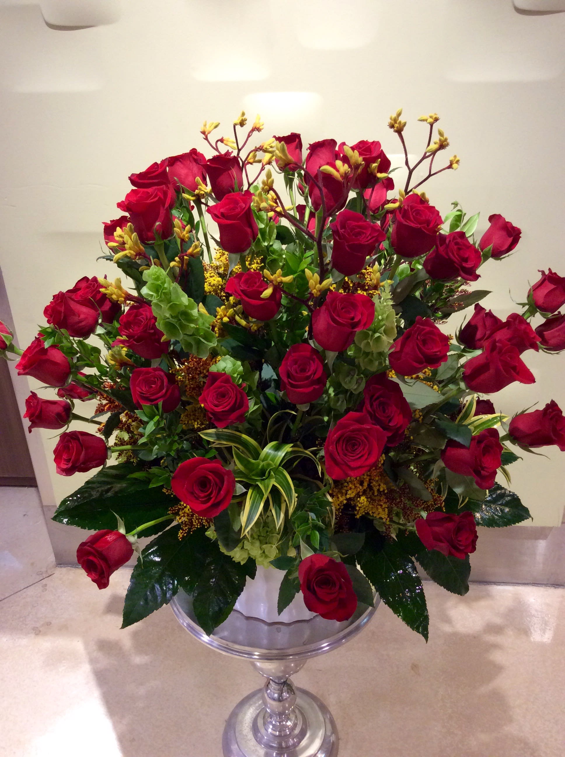 Red Beauty  - This Gorgeous Arrangement is 5 Dozen of our Ecuadorian Long Stem Premium Red Roses in a White Ceramic Container filled with Greens &amp; Hydrangea, This will make everyone in the office Jealous !!!