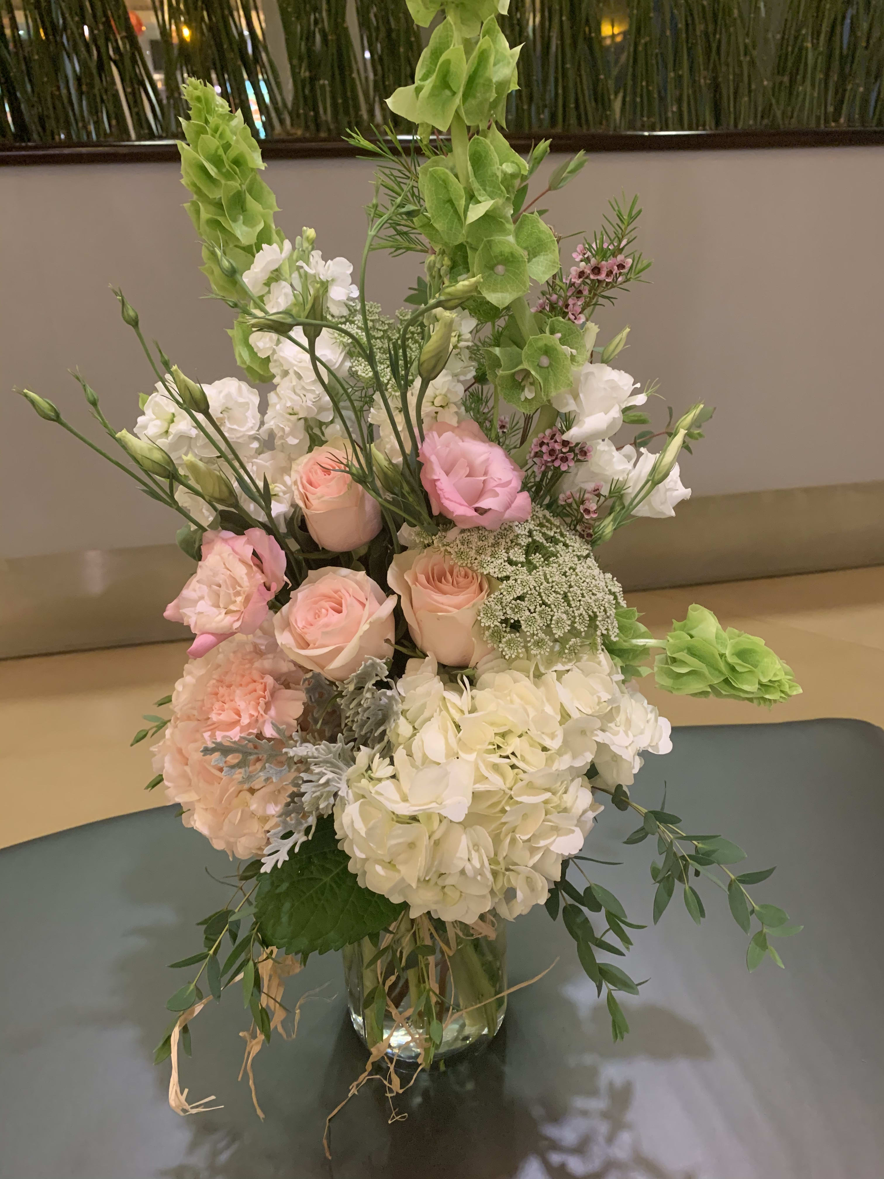 Sweet Blush  - Beautiful Light Pink Roses, Hydrangea's, White Stock with Irish Bells in our mason jars tied.  