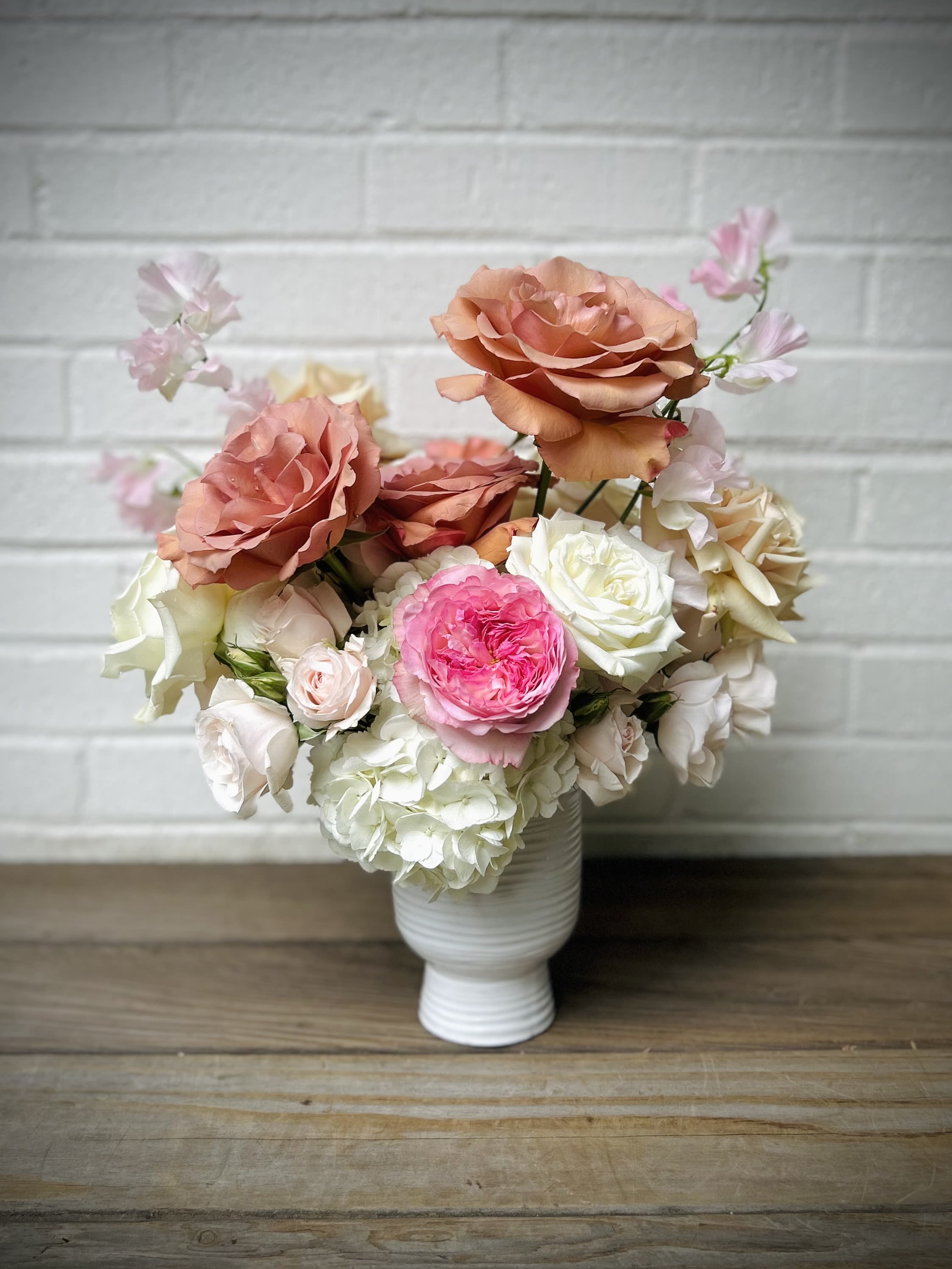 Sugar Pie - Big blush, pink, sand and creamy white blossoms gathered in a ceramic vase.
