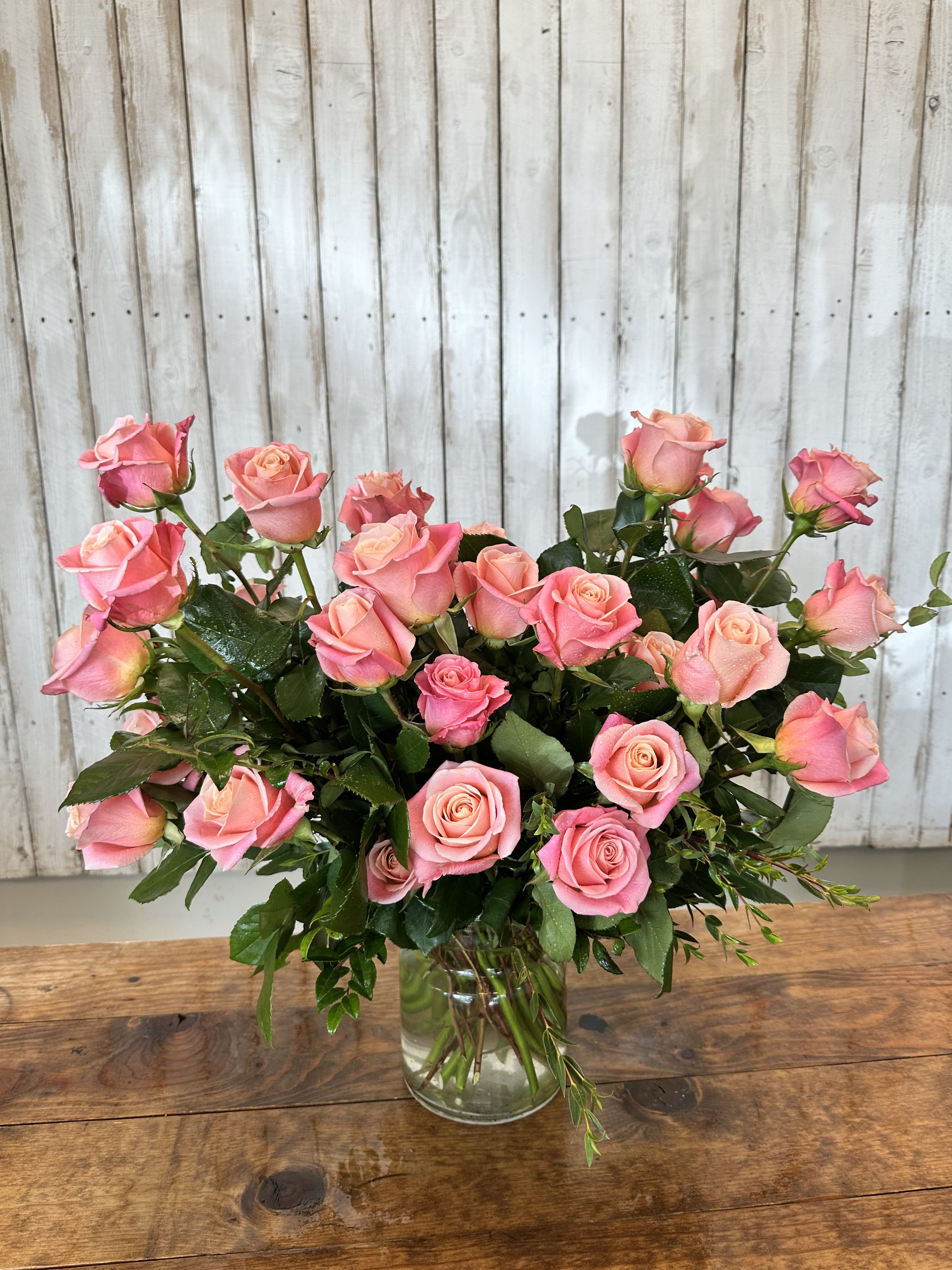 Miss piggy  - Miss Piggy Roses in Glass Vase Our New Miss Piggy Roses are more than just gorgeous pink blooms they’re a showstopper! With their vibrant color and stunningly full petals, these roses make an unforgettable statement. Not only are they breathtaking to look at, but they also carry a beautiful, sweet fragrance that fills the room with elegance. Arranged in a sleek clear glass vase, this design is the perfect blend of charm and sophistication ideal for gifting or brightening up your own space. 3 dozen $225. 4 dozen $285. 5 dozen $395.0