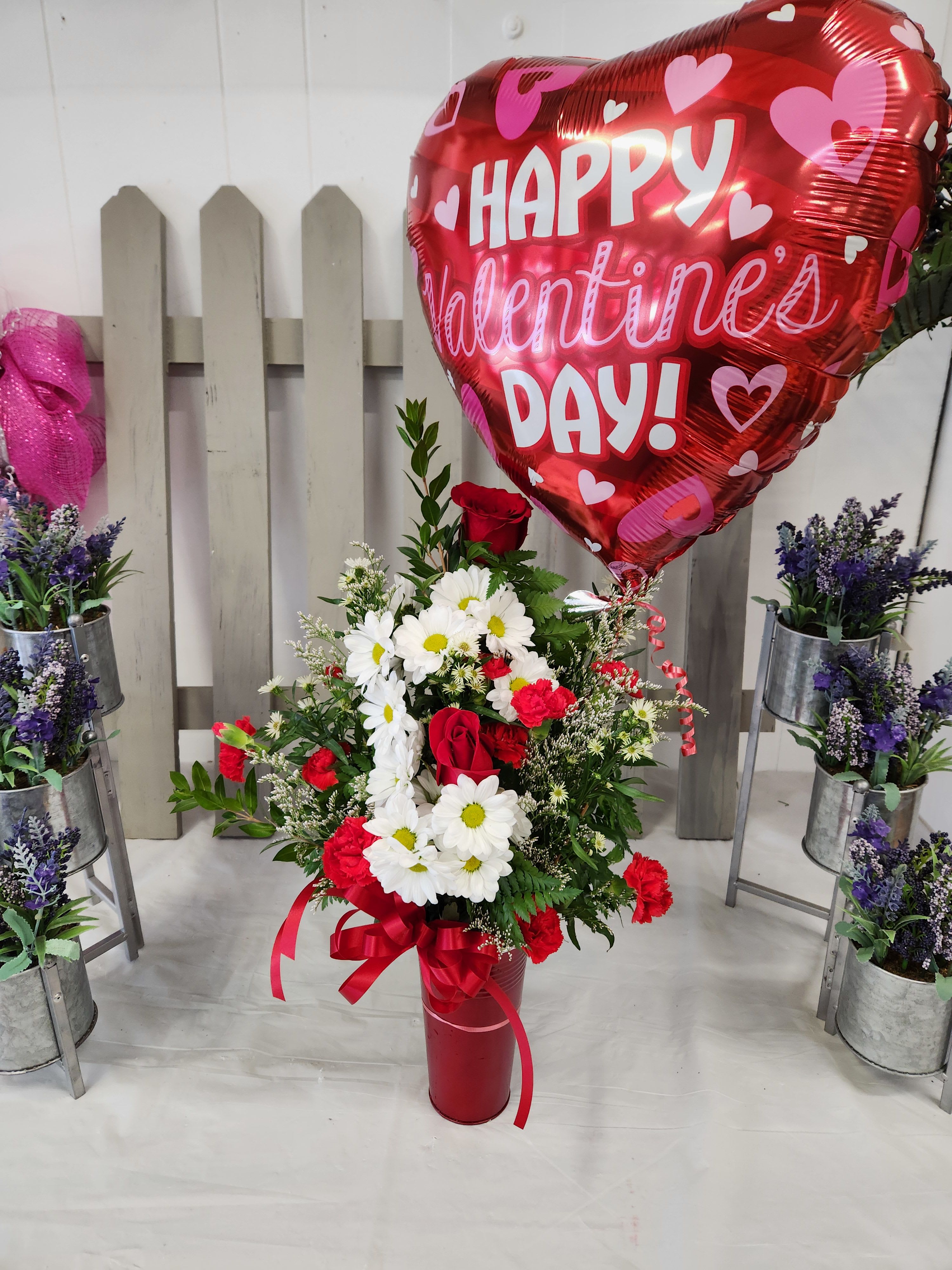 Lovers Lane - 2 red rose, white daises, red carnations with a Mylar balloon. 
