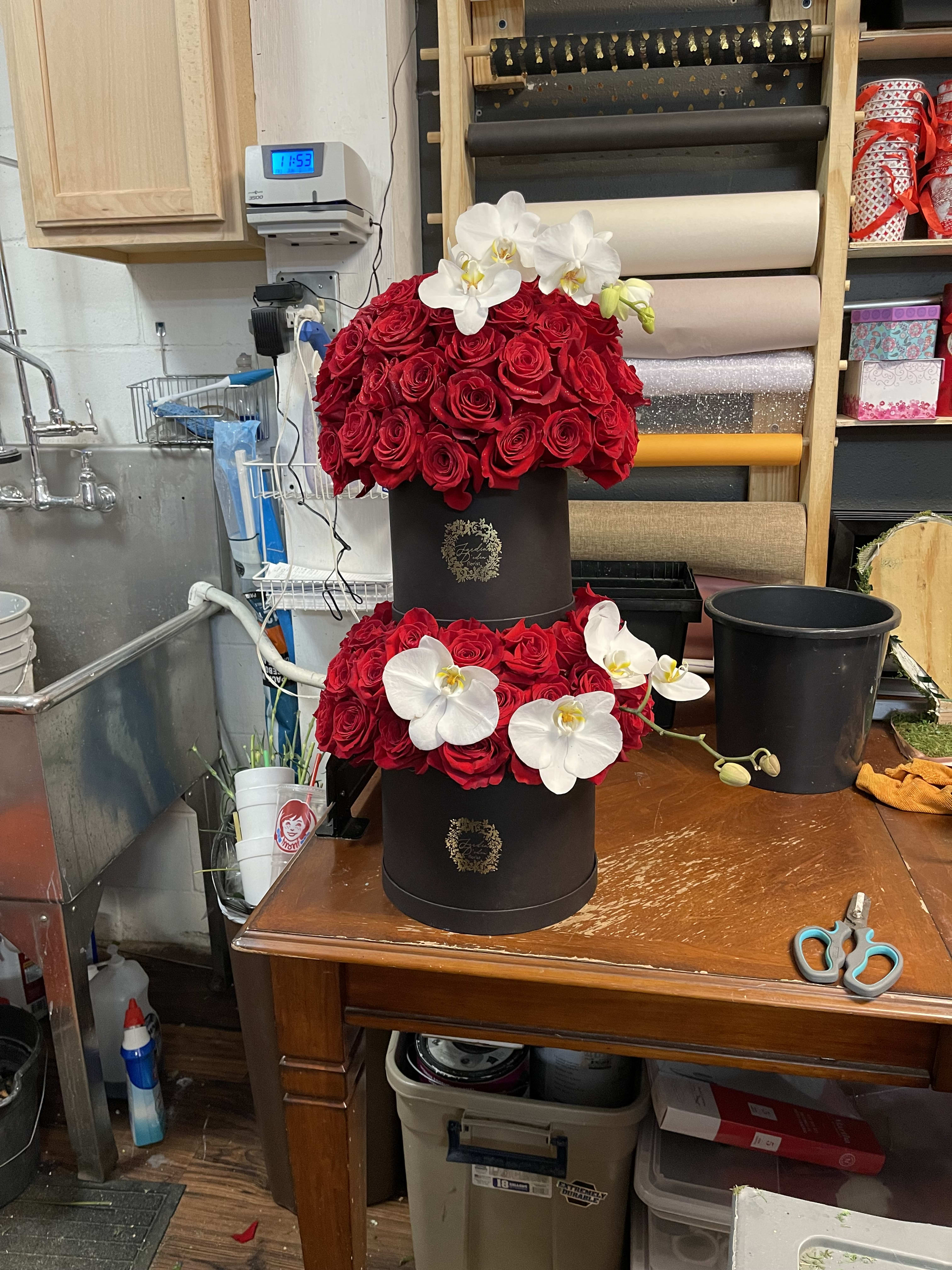 Our Double supreme love bloom box  - This is a double box filled with roses and delicately decorated with orchids making a breathtaking statement 