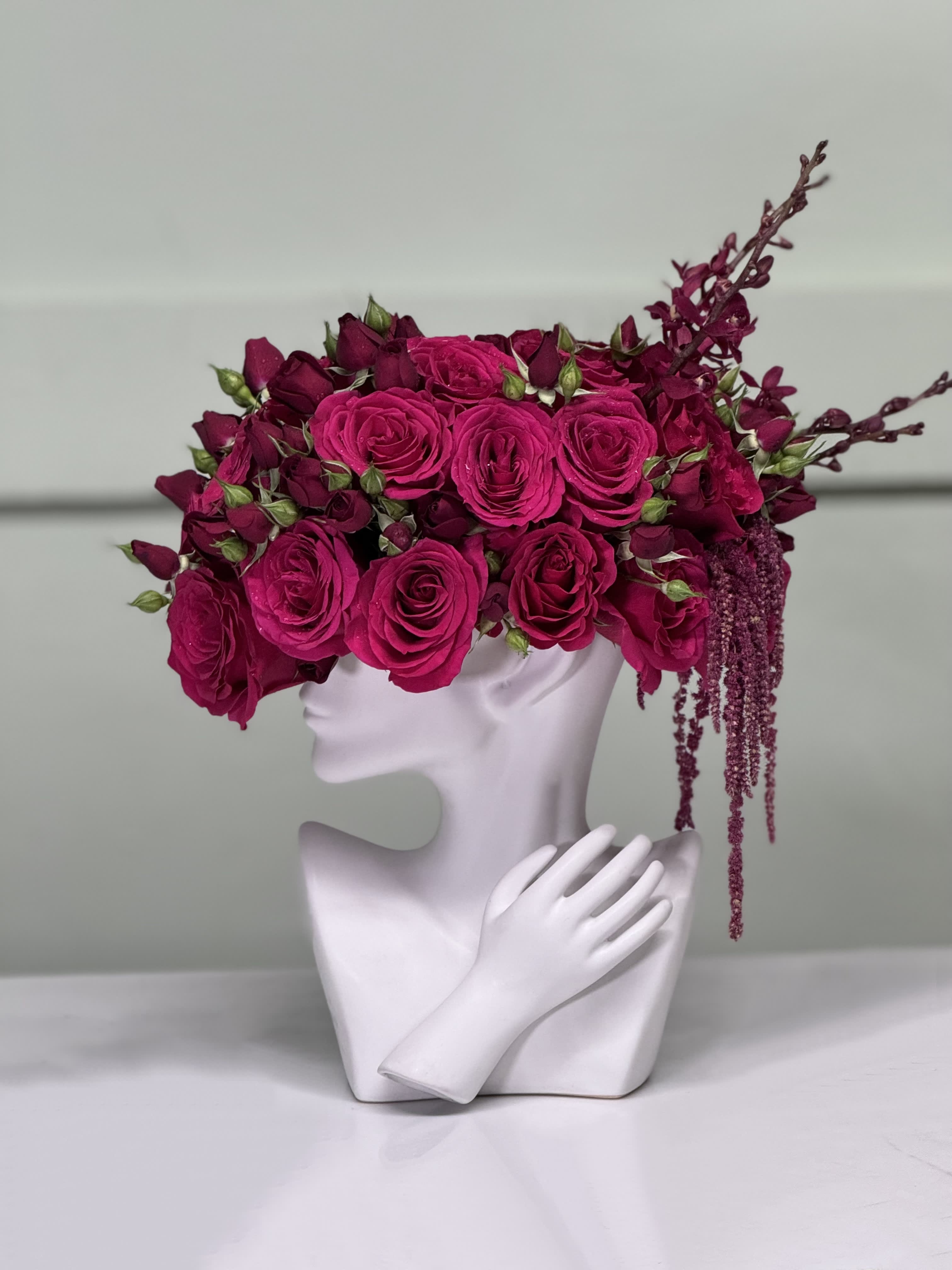 Elegant Lady in hot pink  - Radiant hot pink roses, delicate spray roses, and elegant Amaranthus artfully arranged in a sophisticated ceramic vase, infusing any space with vibrant charm and natural beauty.