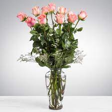 Dozen Long Stemmed Pink Roses by BloomNation™ - These pink roses are cheerful and fun! Dozen Long Stemmed Pink Roses by BloomNation™ is the perfect gift to show your love and appreciation.  APPROXIMATE DIMENSIONS: 25" H X 18" W  