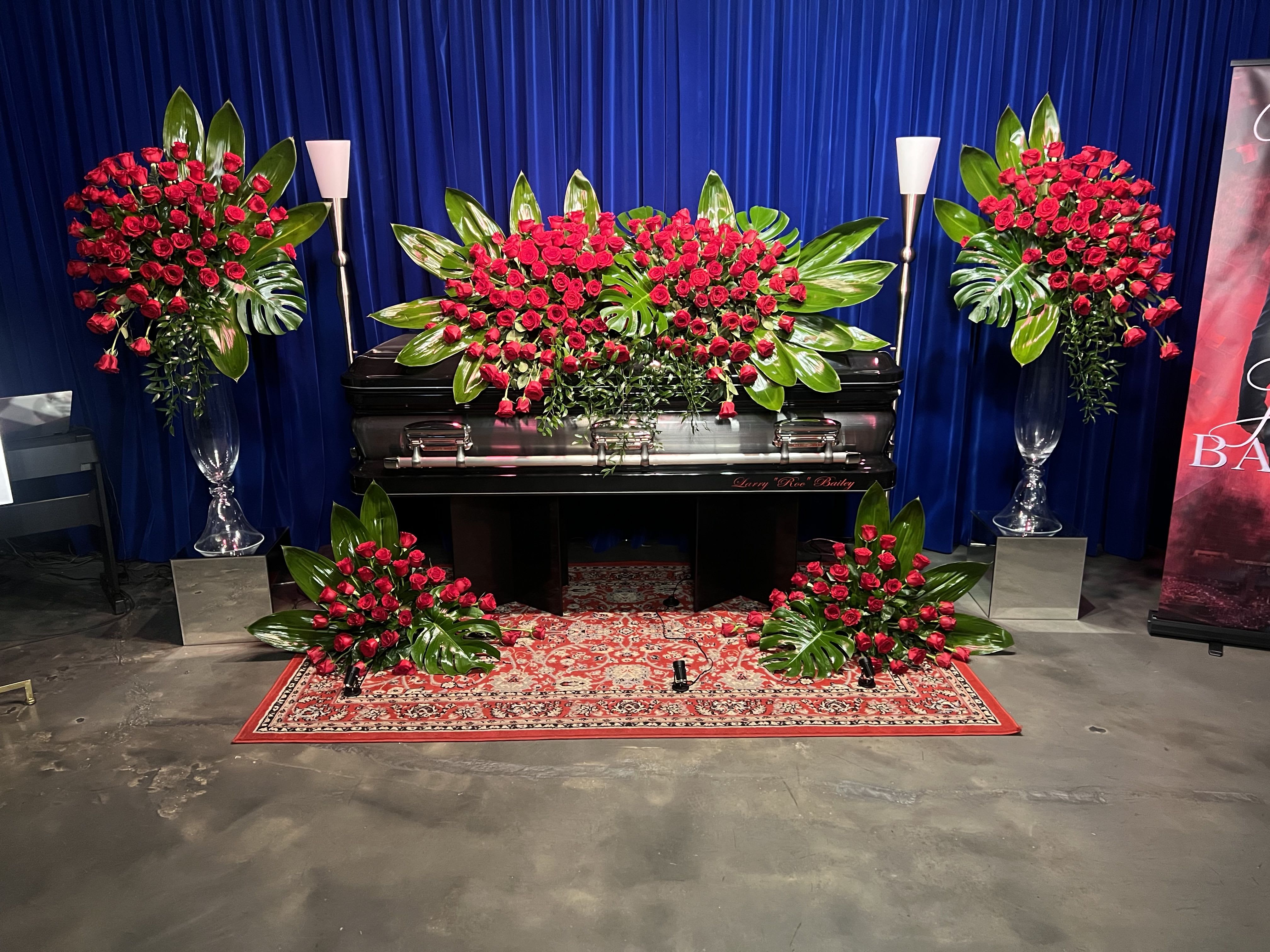 Nothing But Roses by Art of Remembrance - A modern approach to an opulent rose display. This arrangement is design to evoke a sense of awe, beauty and warmth. 