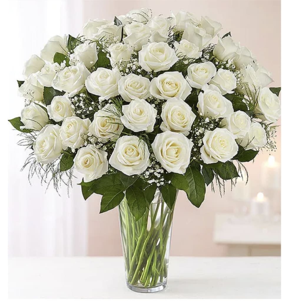 Ultimate Elegance ™Premium Long Stem White Roses - Description Our striking long stem white roses are the ultimate way to show you care. Two, three or four dozen pure white blooms are artistically arranged by our expert florists inside an elegant glass vase and personally hand-delivered to help you express how you feel straight from the heart.