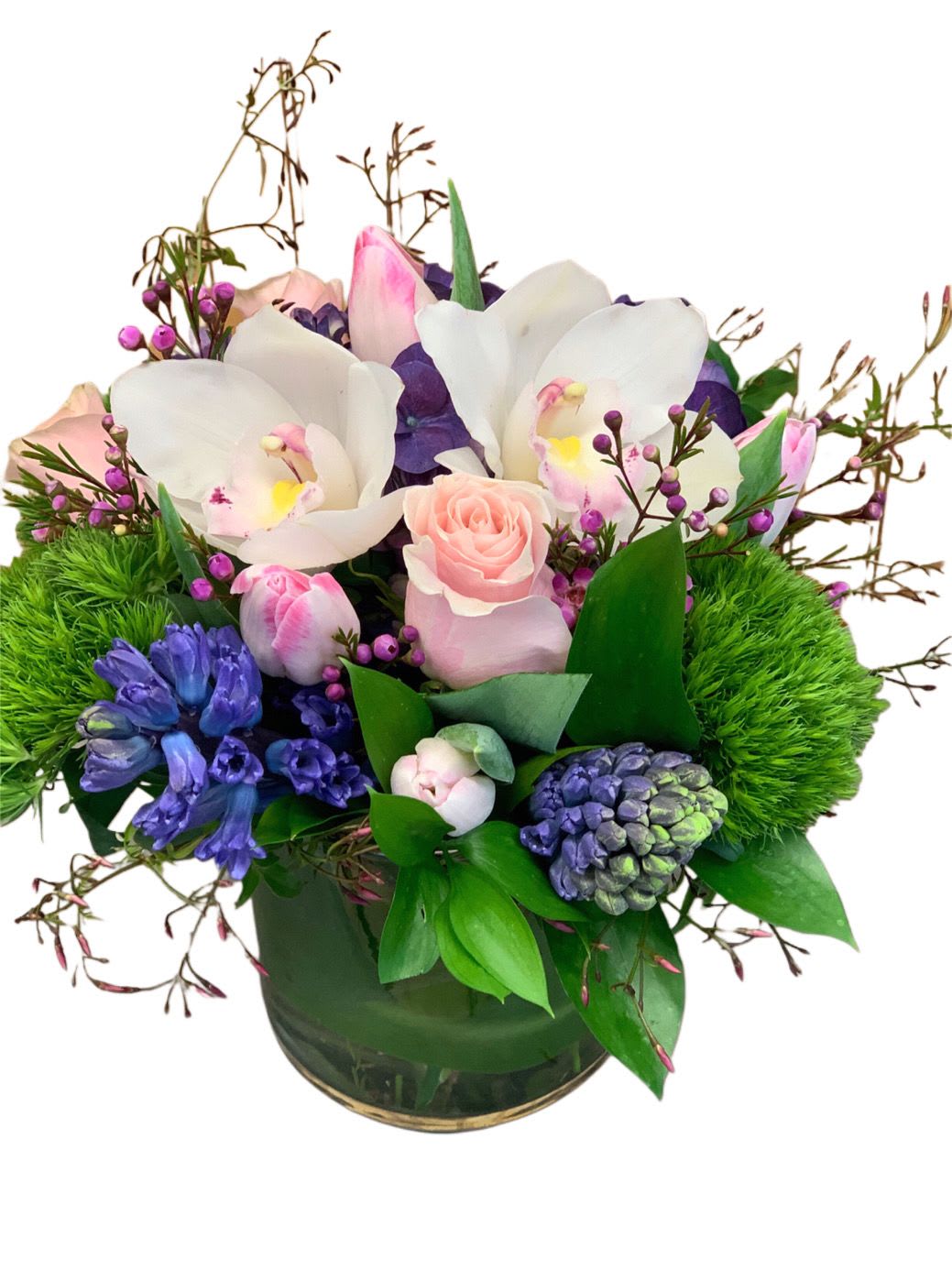 Capri - Hyacinths, tulips, roses and orchids in a cylinder vase. 