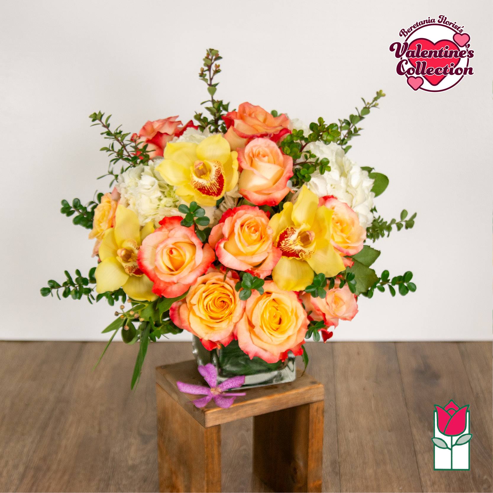 [Valentine's] Olivia Bouquet (Peach Rose &amp; Yellow Cymbidium) [Peach Hue Varies] - Elevate your space with the Beretania Florist Compact Bouquet, a charming floral arrangement that effortlessly combines elegance and versatility. Housed in a beautiful 4" glass cube vase, this compact bouquet features a delightful composition of hydrangeas, foliage, and your choice of roses in various colors, allowing you to tailor it to your preferences.  Whether you opt for the timeless allure of red roses, the soft romance of pink, or the vibrant cheerfulness of yellow, each variant of the compact bouquet brings a unique charm to any setting. The meticulous design ensures a harmonious blend of textures and hues, creating a visually appealing arrangement that suits any occasion.  For those seeking an extra touch of sophistication, consider our upgraded option – the Olivia Compact Bouquet. This variant remains true to the original design but introduces the exotic beauty of colorful cymbidium orchid blossoms, elevating the bouquet to a new level of elegance.  Perfect as a thoughtful gift or a stunning addition to your own space, the Beretania Florist Compact and Olivia Bouquets are crafted with precision and care, promising a burst of floral beauty that suits your style and preferences. Choose the color that speaks to you and let the timeless beauty of these bouquets brighten your day.  Trust us to deliver not just flowers but a seamless and delightful experience right to your doorstep or preferred pick-up location in Honolulu. 