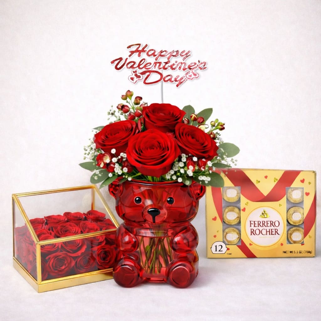 Romantic Ruby Bear Roses Set - A striking romantic gift featuring premium red roses arranged in a charming ruby bear glass vase, complemented by a luxury acrylic rose keepsake box and a classic Ferrero Rocher chocolate selection. Finished with a festive Valentine’s topper, this elegant set is designed to create a memorable and luxurious expression of love. Better for: Valentine’s Day, anniversaries, engagements, romantic occasions, I love you. 