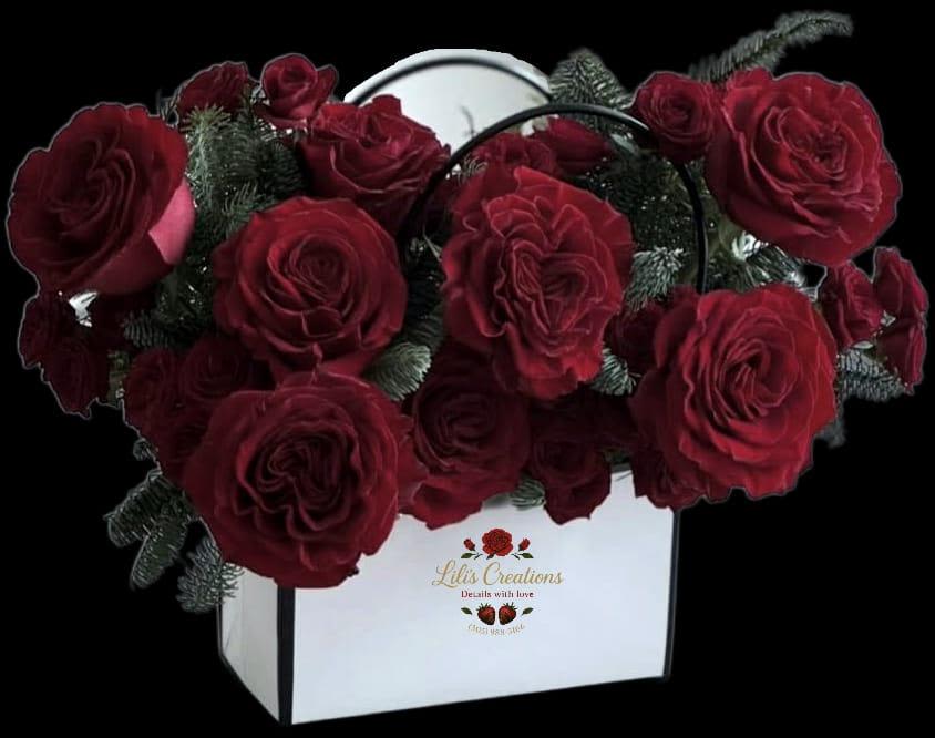 LALA - A beautiful square, wallet-shaped box filled with red roses and adorned with a lovely ribbon. Ready to melt the heart of your loved one.