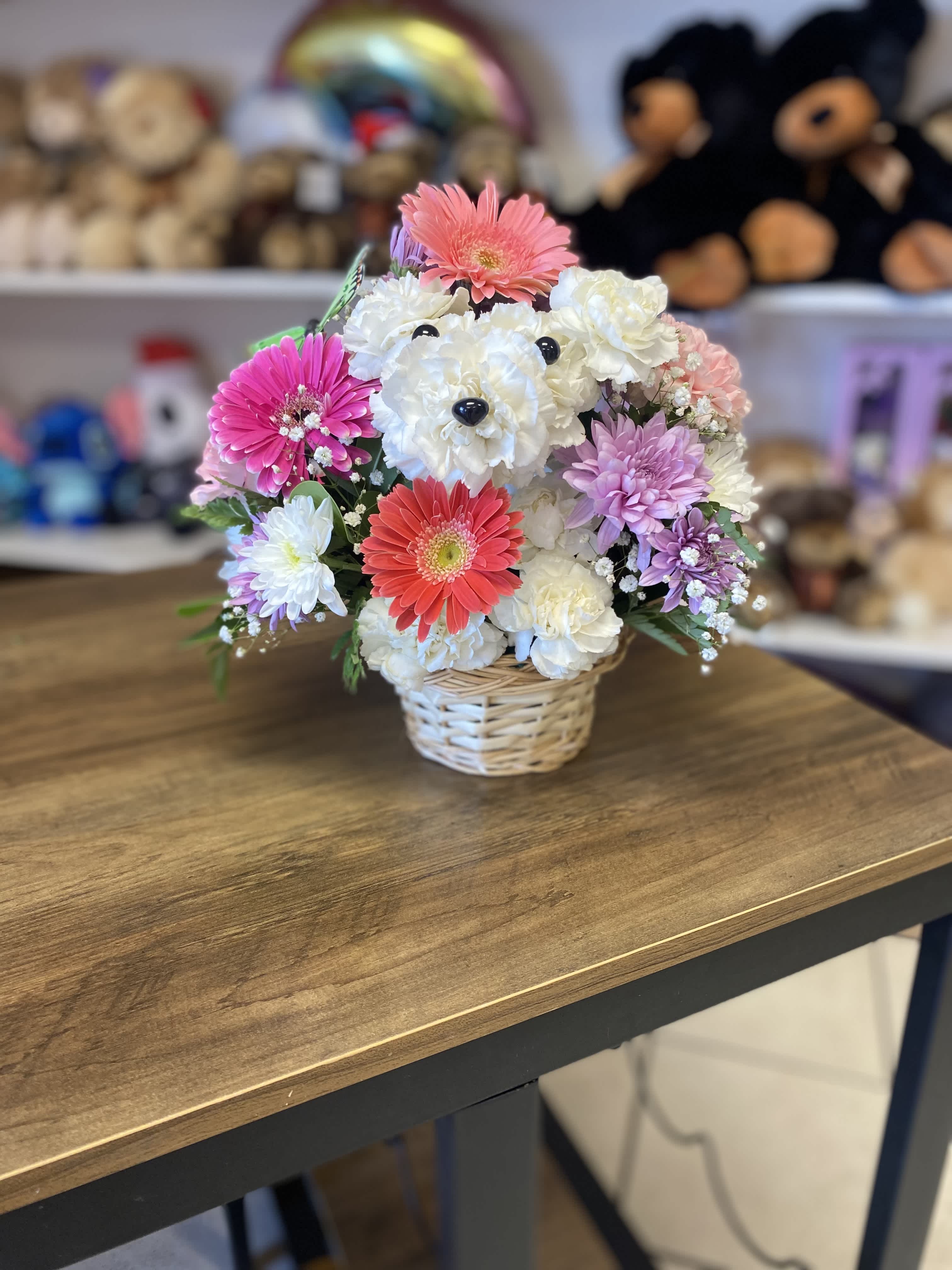All Occasions Puppy - Adorable and unique, this flower puppy arrangement is handcrafted with fresh white blooms and accented with colorful flowers in a charming basket design. Perfect for birthdays, new baby gifts, get well wishes, or special surprises. Designed by Amour Flowers with same-day flower delivery available in El Paso, Texas.