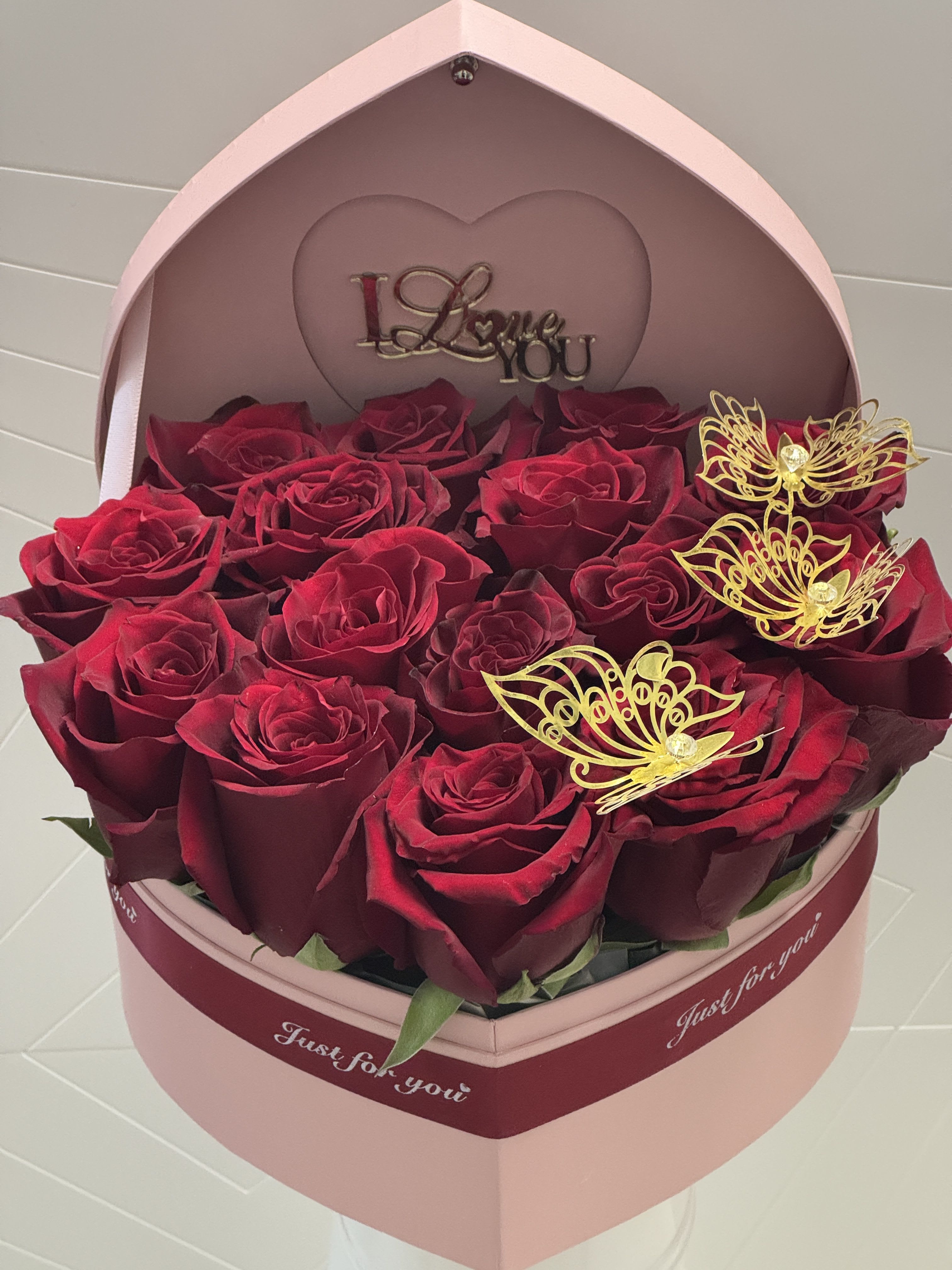Candy Hearts  - Pink heart with red roses for that spacial person make this arrangement super special. Picture shows deluxe.  The gold message can be either I love you or happy Valentine’s Day depending on availability. 