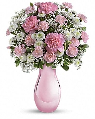 Radiant Reflections Bouquet - Hurray for pink! Celebrate your sweet one with this sentimental bouquet - a delightfully pink mix of pink and white blooms presented in a keepsake Pink Reflections vase she'll cherish always. Pink carnations, white button chrysanthemums and million star gypsophila are accented with fresh greens. Delivered in a Pink Reflections vase. 