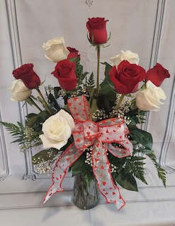 Valentine Classic - This classic red and white rose is the perfect expression of love for Valentine's Day.  This arrangement is adorned with 6 gorgeous red and 6 stunning white roses.  Tell someone you love them today!  