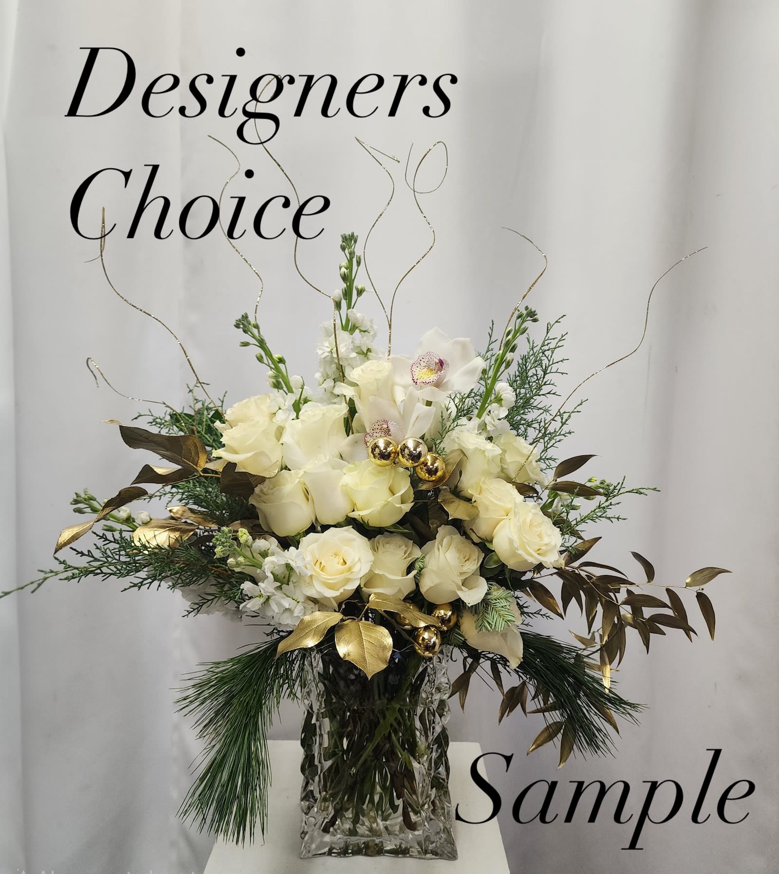 White &amp; Gold - Designer's Choice - *Photo is provided for illustration purposes - individual flower selection will vary, color scheme will be maintained*  A floral arrangement with mix of available flowers ranging from Carnations, Lilies, Alstroemeria, Roses to many other items. The arrangement will be filled to value with premium flowers used based on the price point selected. The arrangement will be primarily the color you selected but will be complimented with various colors based on our skillful designers choice.  Please note any flowers or colors you wish NOT to be included in the special notes section. 