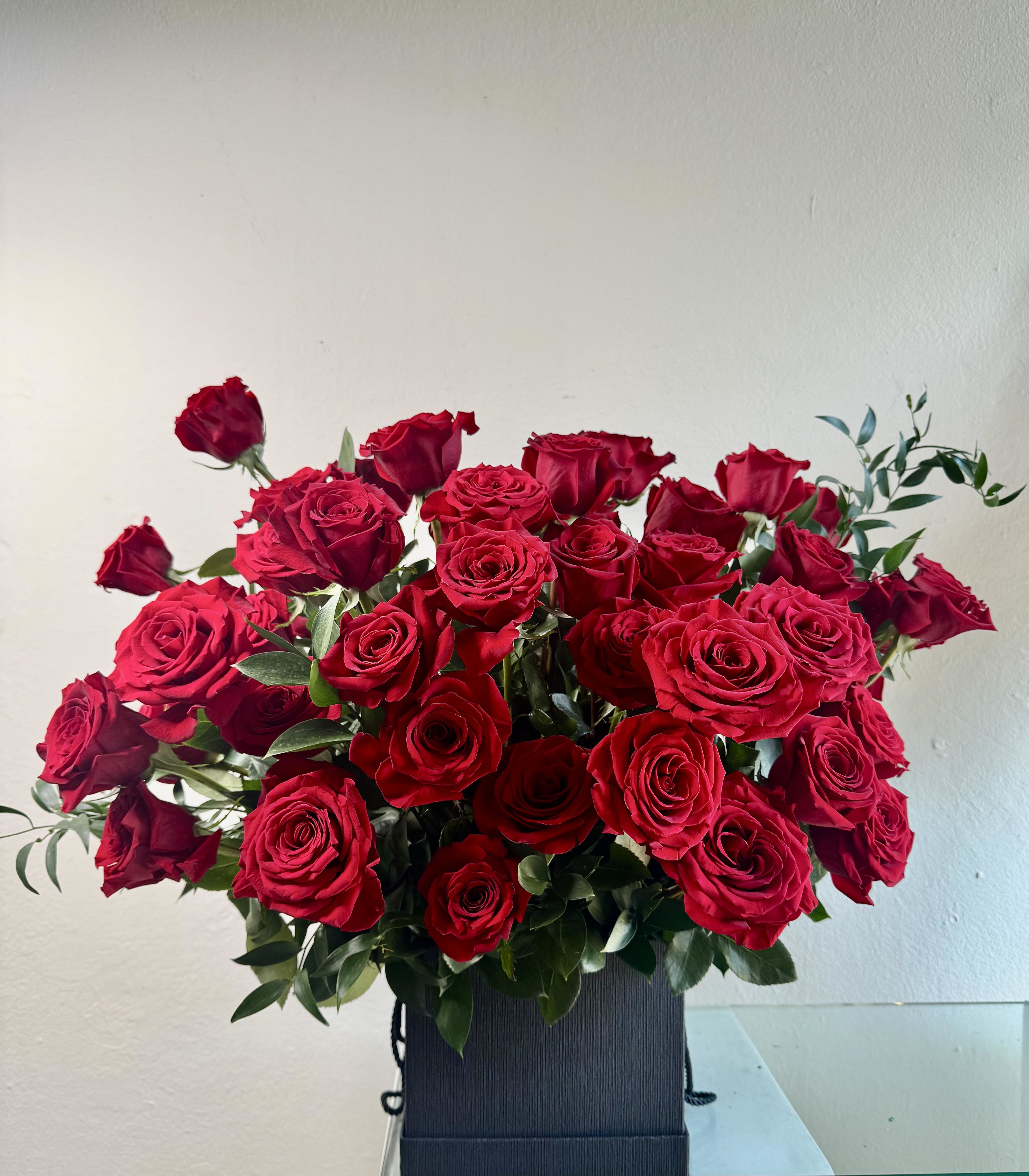 LOVE SPELL /  4 dozen - LOVE SPELL - 4 Dozen red Roses -  Lush &amp; Gorgeous 4 dozen roses in a black container.  Sure to impress your Valentines...