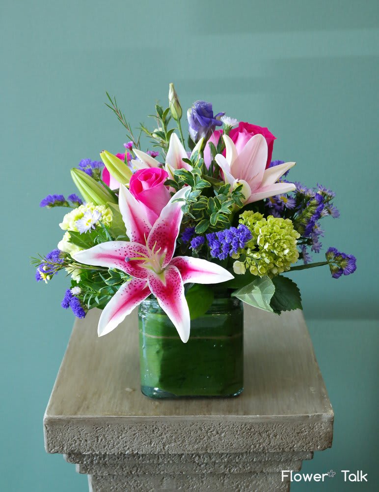 Summer Memories - Stargazer lilies, pink roses, purple lisianthus and green hydrangeas - arranged to send a pop of fun to anyone. A sweet gesture we're sure anyone would appreciate.