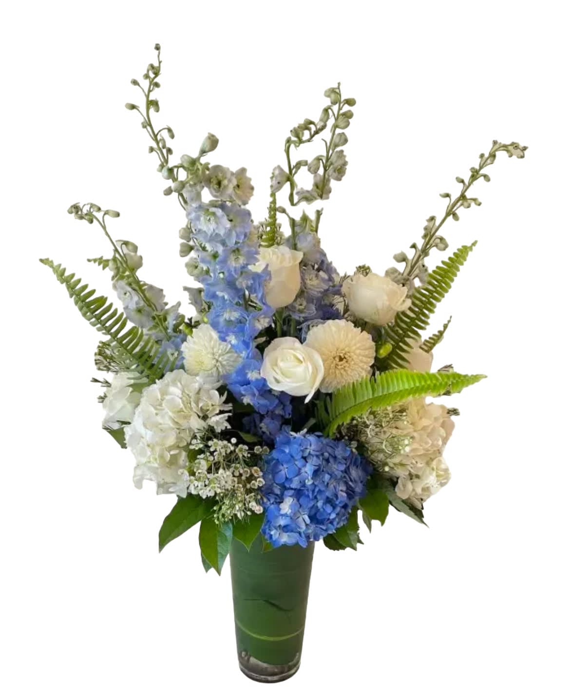 Classic White &amp; Blue - Hydrangeas, dahlias, blue delphinium, roses, fern and more designed in a tall vase.
