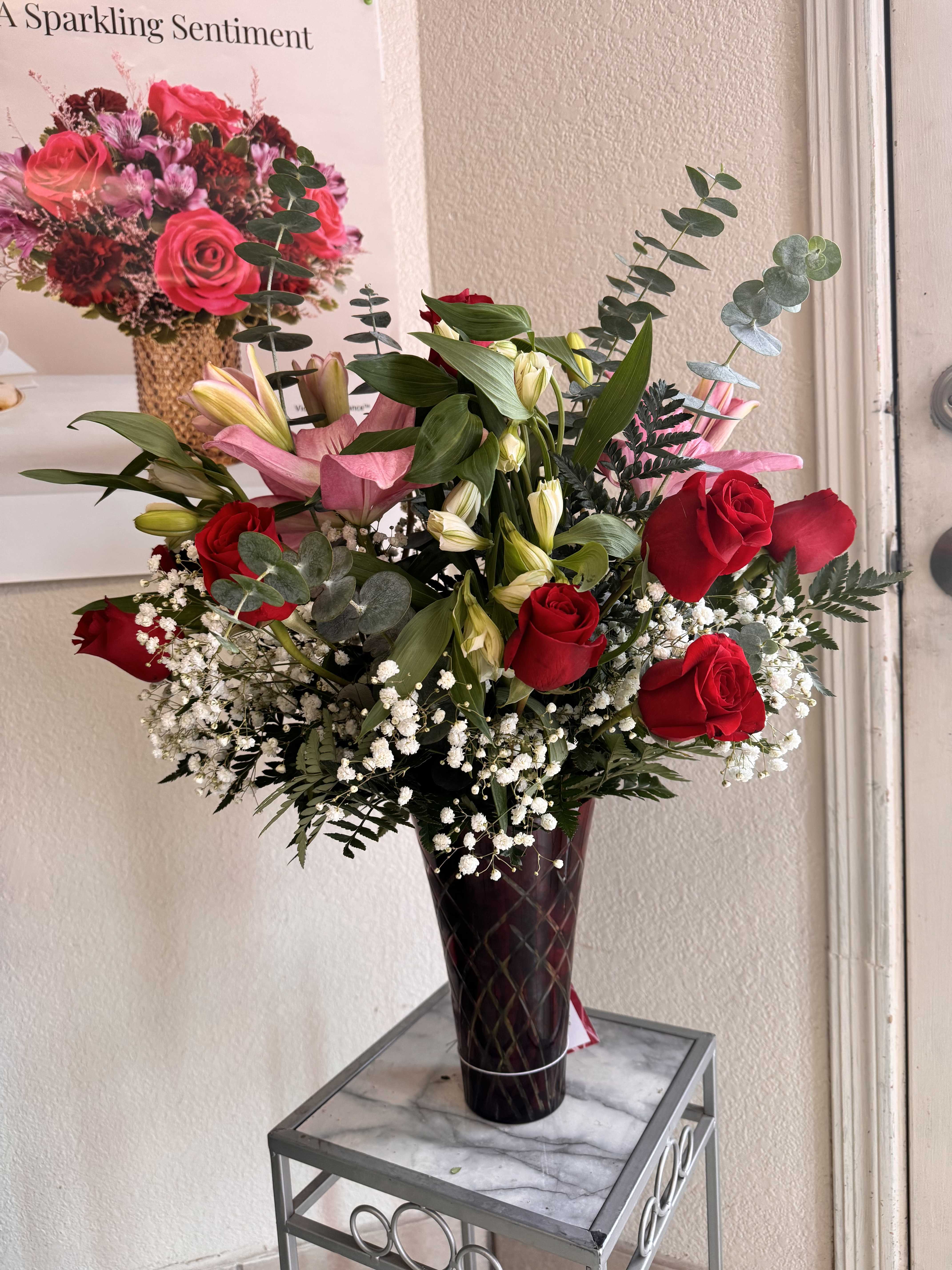 Ultimately for Yours - A Ultimately Beautiful array of floral and greens combined in a slender vase that Ultimately surprise that special someone on any occasion. 