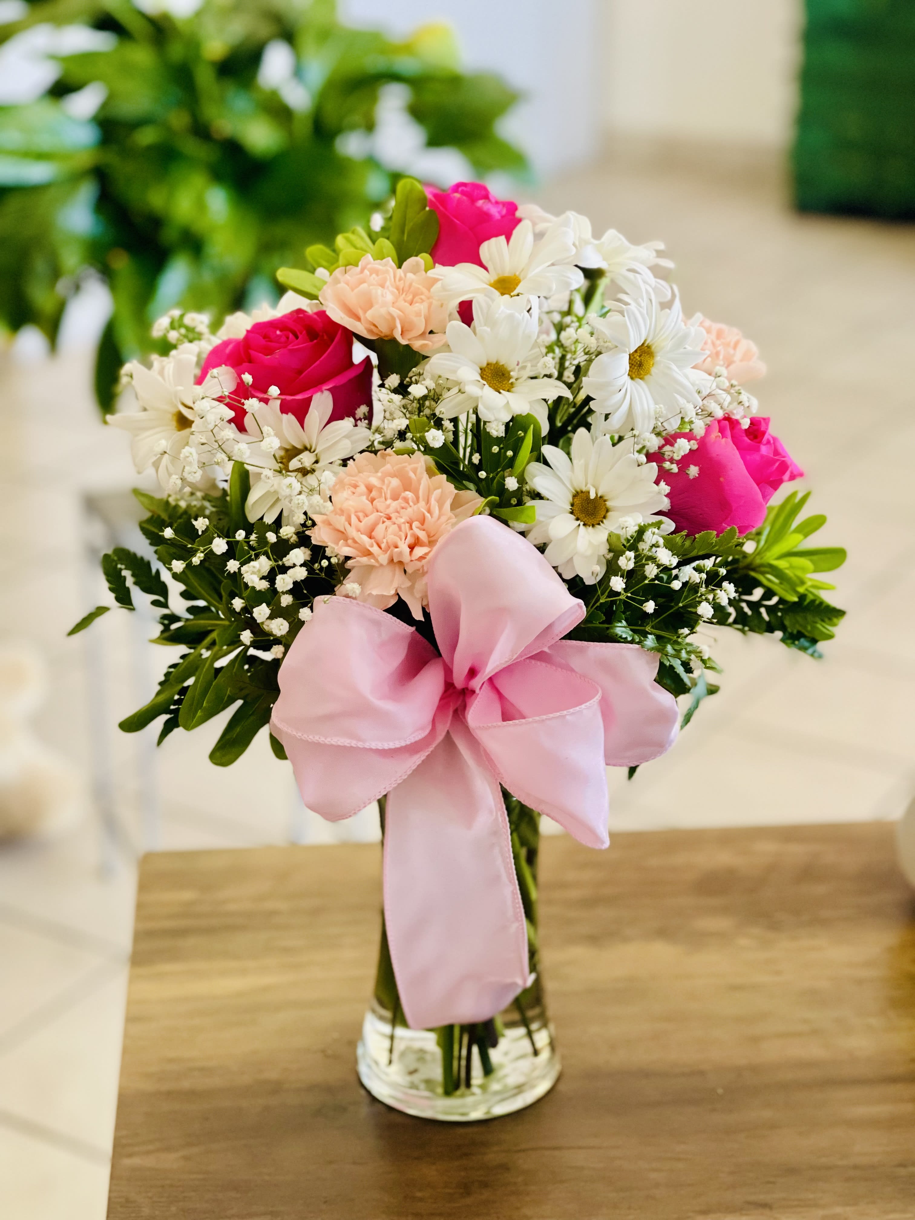 Pink and white Bliss - Sweet and elegant, this pink and white mixed flower arrangement features fresh roses, daisies, and seasonal blooms accented with lush greenery and a soft ribbon in a clear glass vase. Perfect for birthdays, celebrations, or sending a thoughtful surprise. Handcrafted by Amour Flowers with same-day flower delivery available in El Paso, Texas.