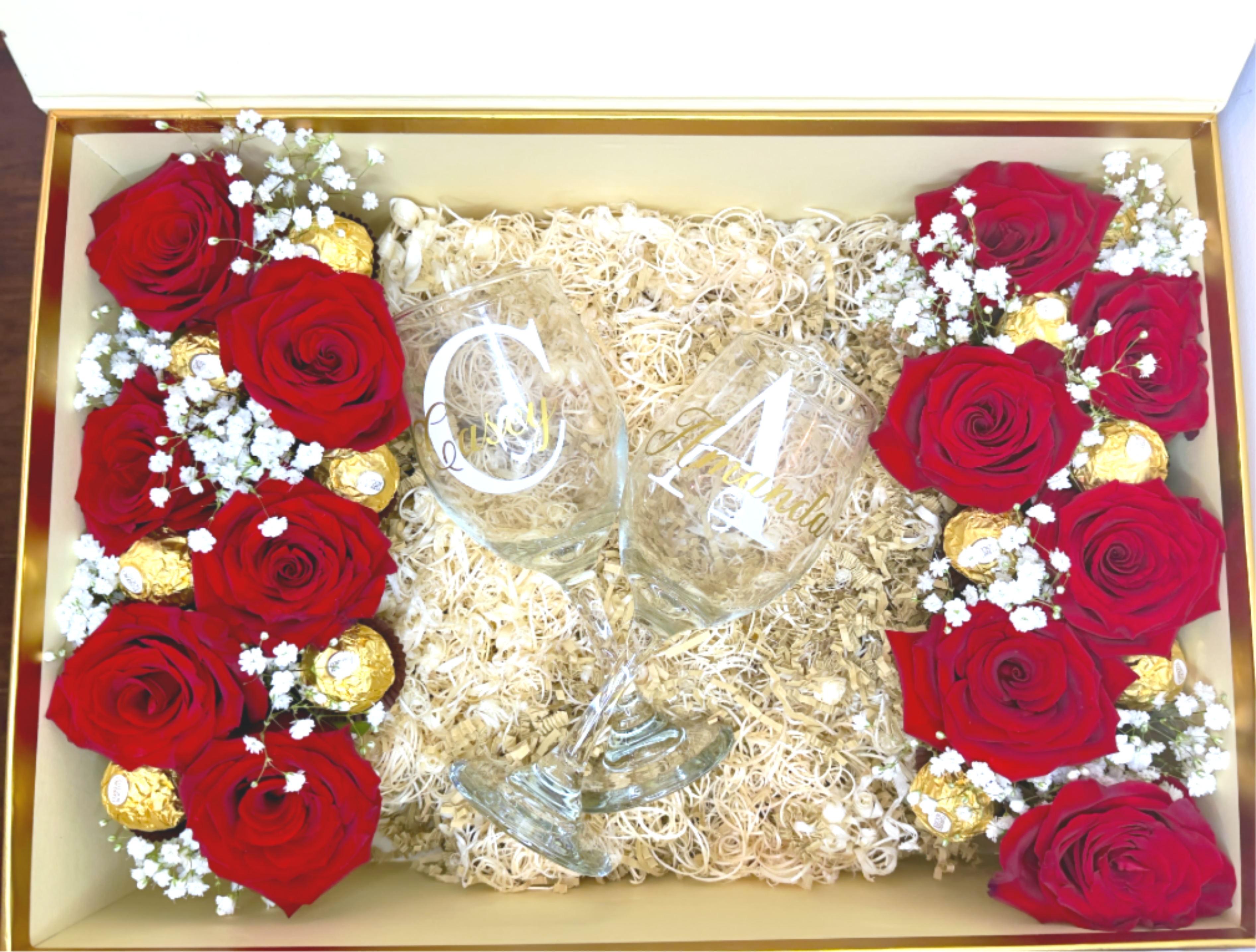 Valentine's Box -  Surprise your loved one with our elegant and romantic Luxury Personalized Valentine’s Rose Box. This beautiful gift includes fresh red roses, Ferrero Rocher chocolates, and two personalized wine glasses with custom initials.  Carefully designed with premium details, this box is perfect for Valentine’s Day, anniversaries, weddings, or any special occasion.  Each box is handmade with love and customized especially for you.  Includes: ️ Fresh red roses ️ Ferrero Rocher chocolates ️ 2 personalized wine glasses ️ Luxury gift box ️ Elegant floral design   Custom names/initials included  Ready for gifting  Made with love by Gift Box &amp; Flowers 