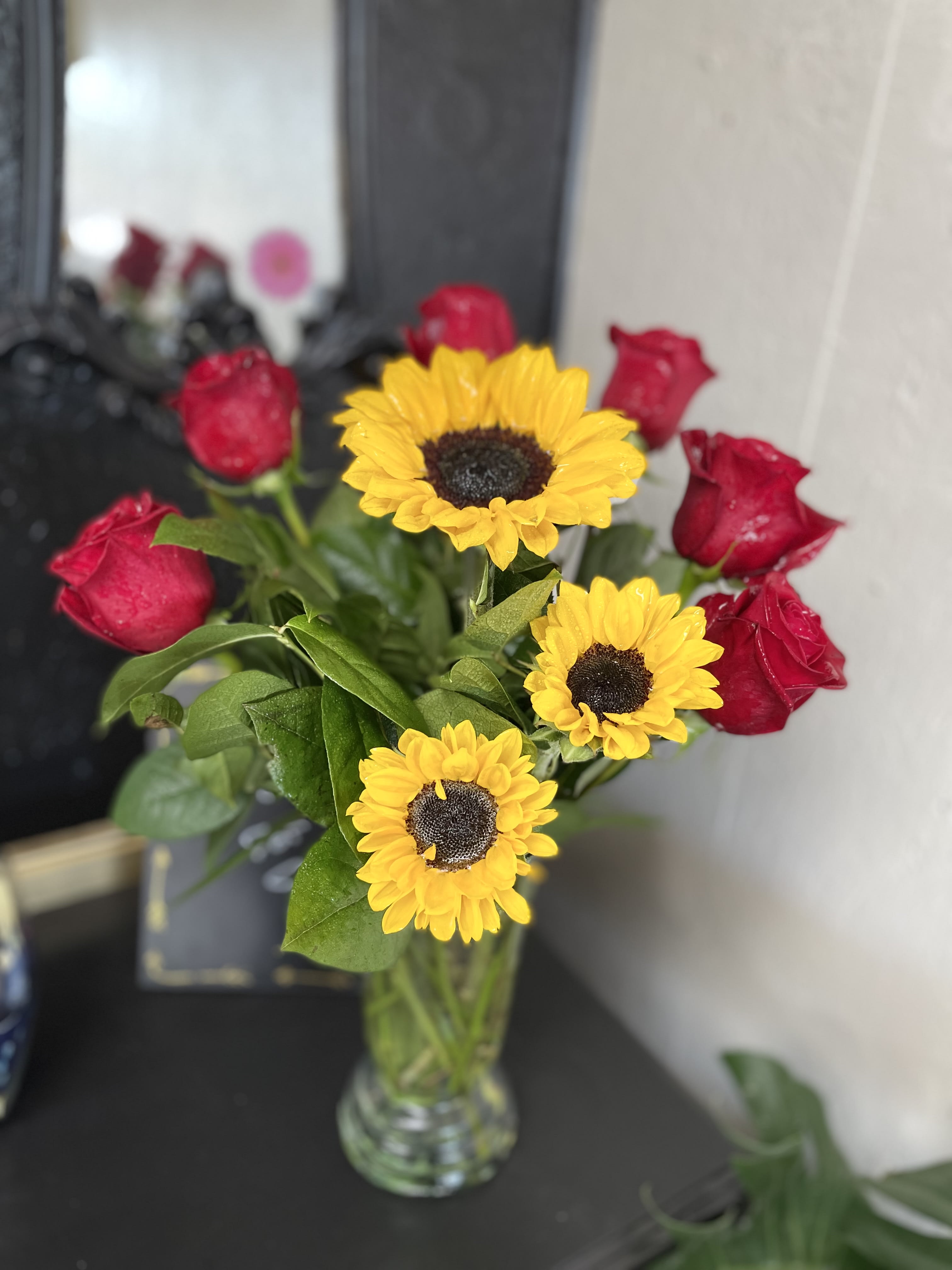 Fire Love  - Sunflowers (two different sizes), red roses, greenery and clear vase. 